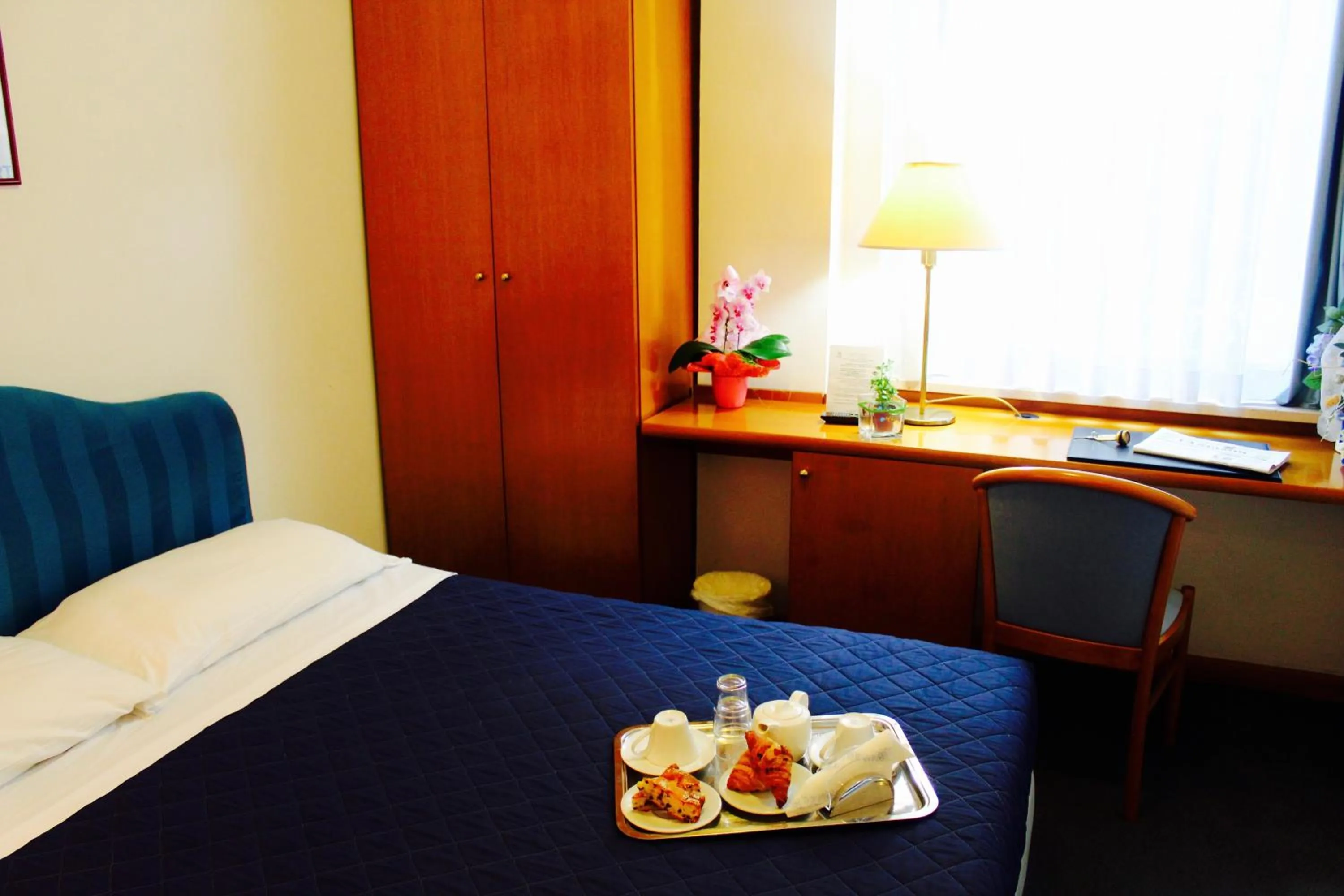 Bed in Arcangelo Roof Hotel