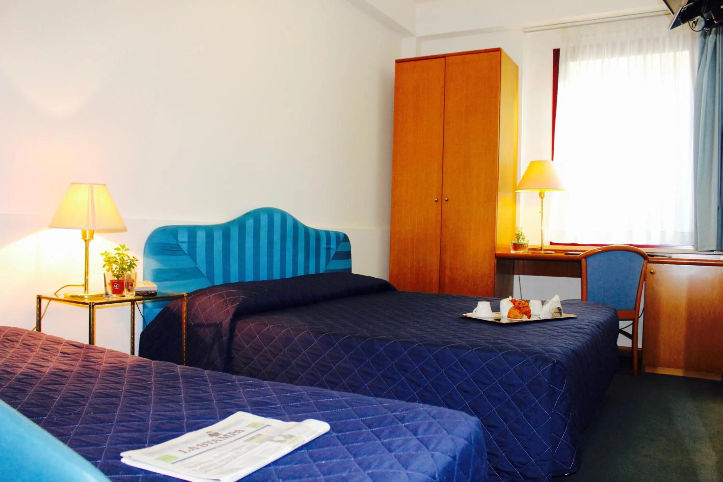 Bed in Arcangelo Roof Hotel