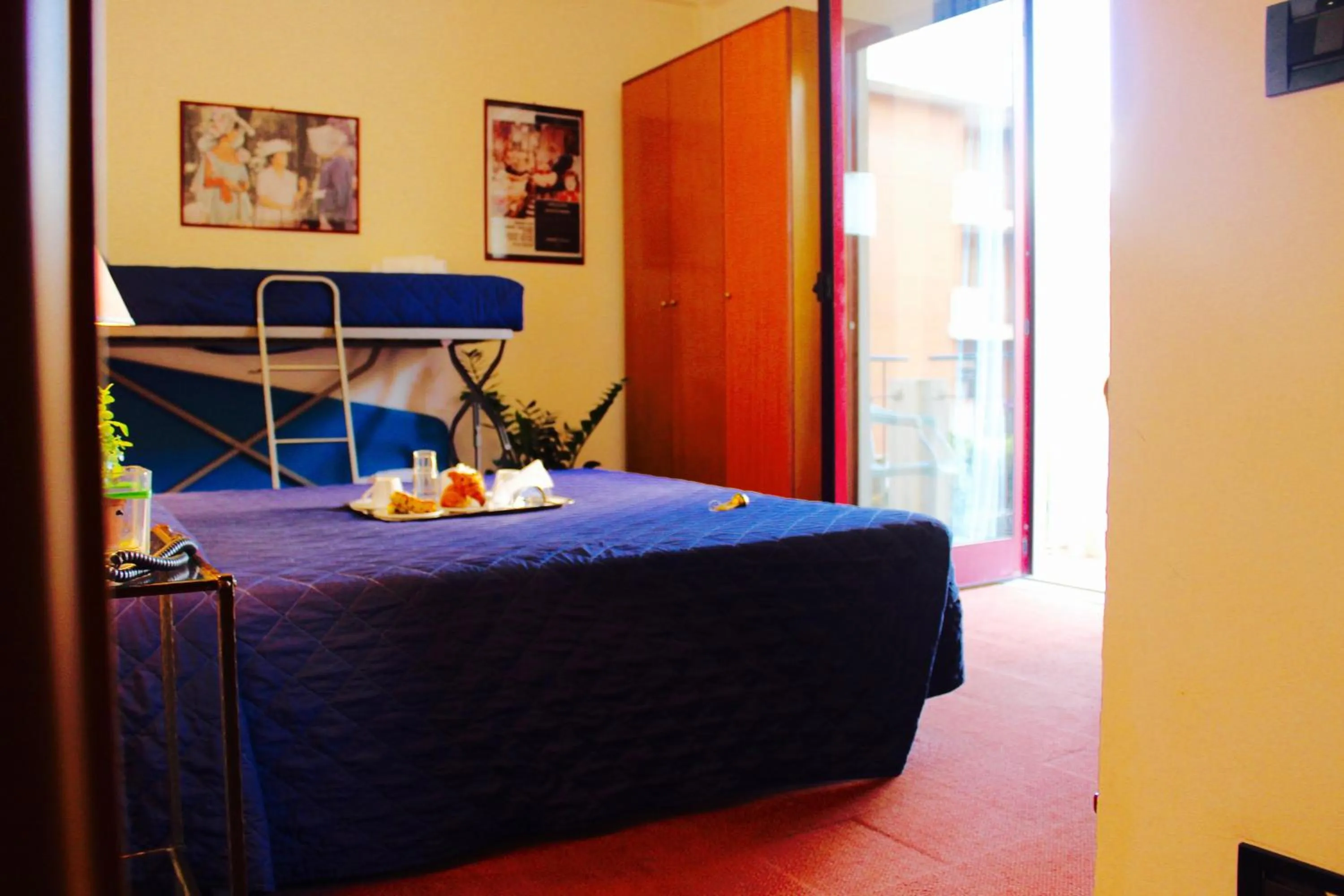 Bed in Arcangelo Roof Hotel