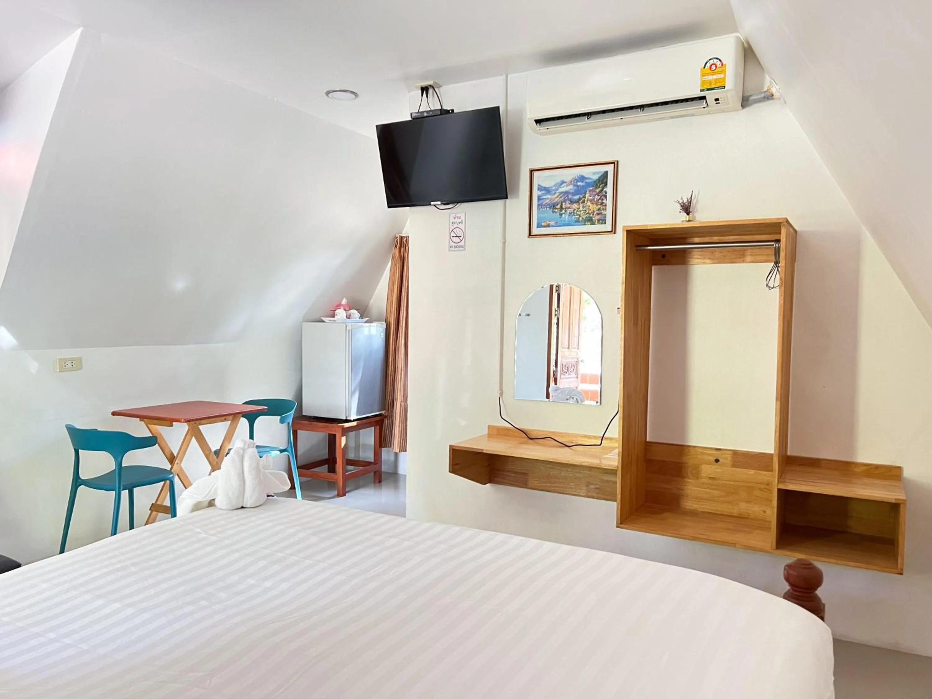 Bed in Pijittra Resort