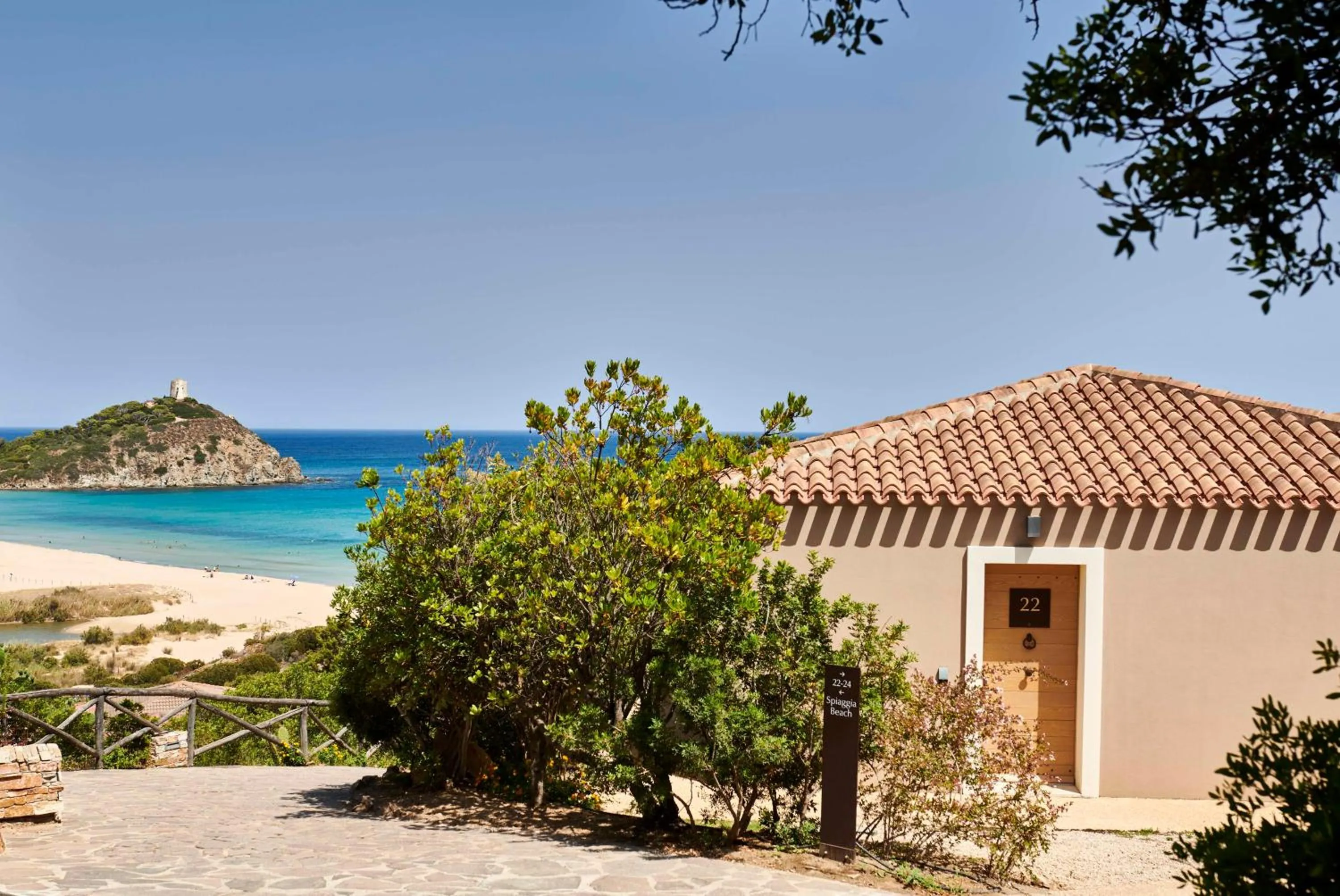 Property building in Baia Di Chia Resort Sardinia, Curio Collection By Hilton