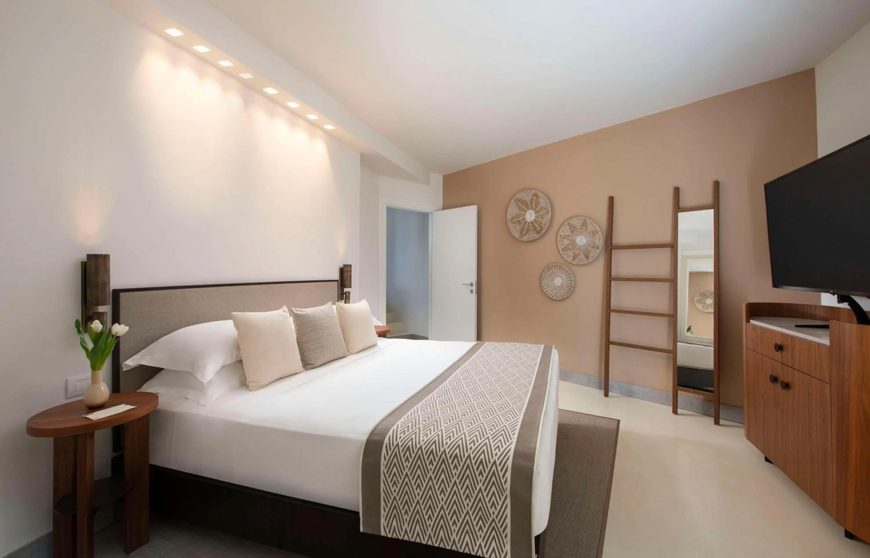 Bedroom, Bed in Baia Di Chia Resort Sardinia, Curio Collection By Hilton