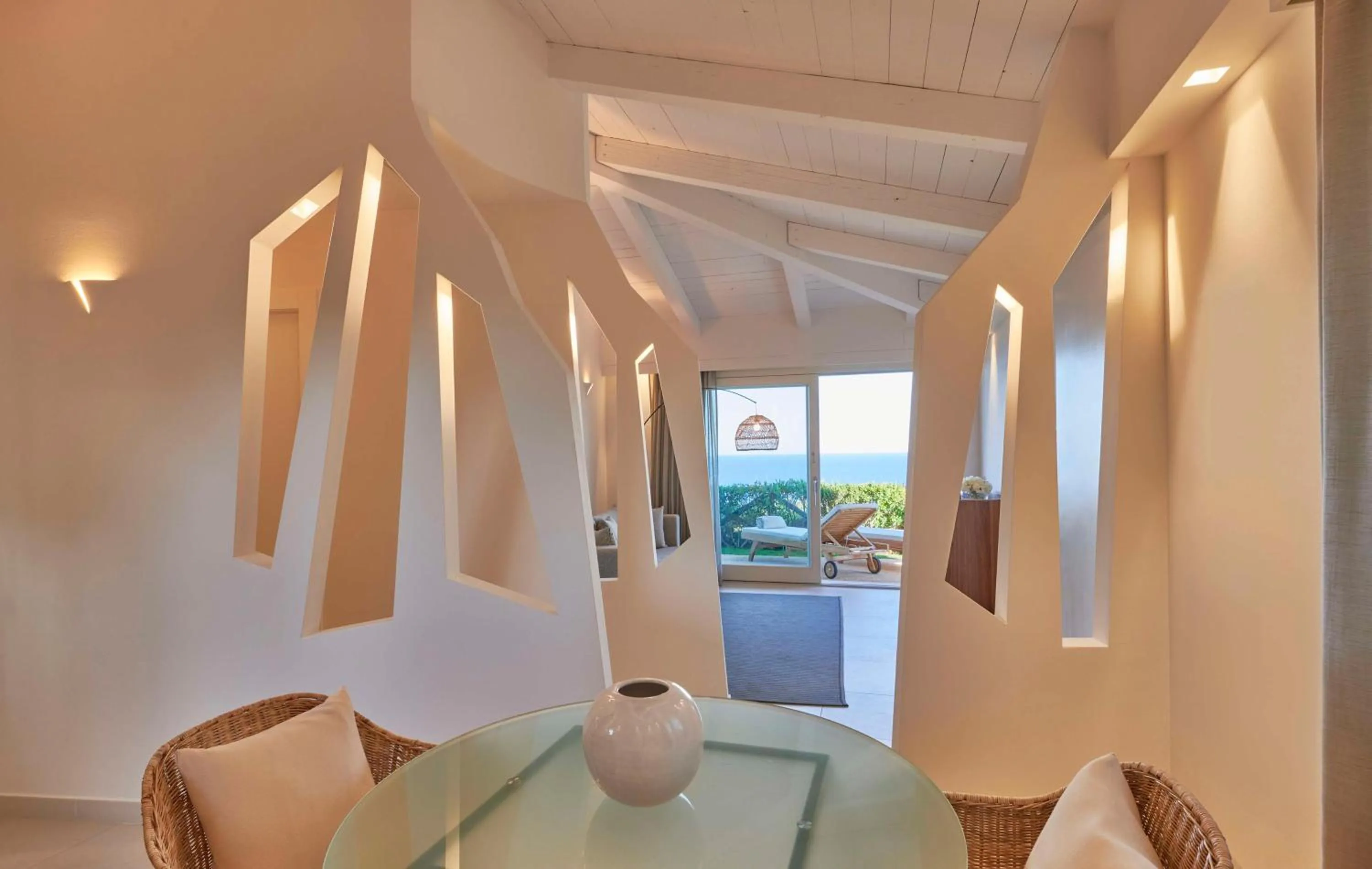 Living room in Baia Di Chia Resort Sardinia, Curio Collection By Hilton