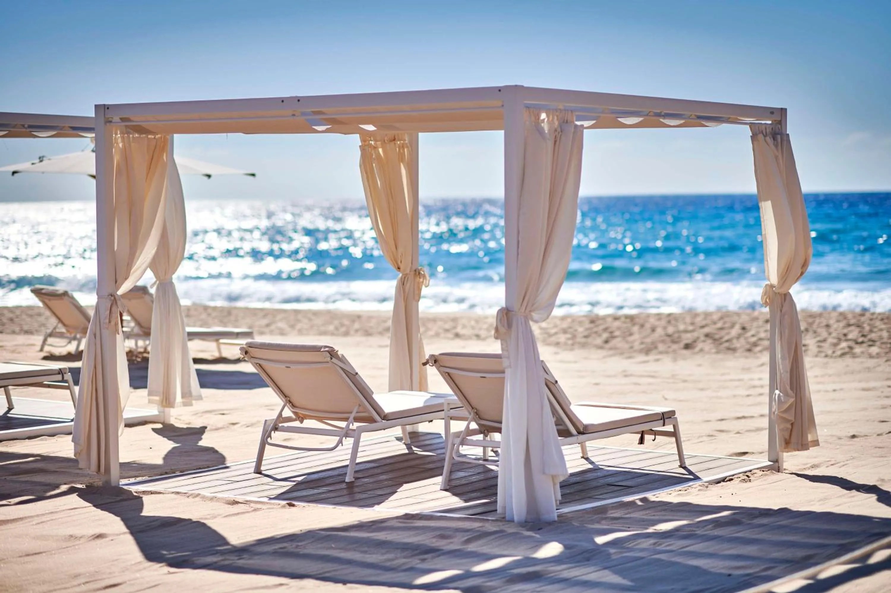 Property building in Baia Di Chia Resort Sardinia, Curio Collection By Hilton