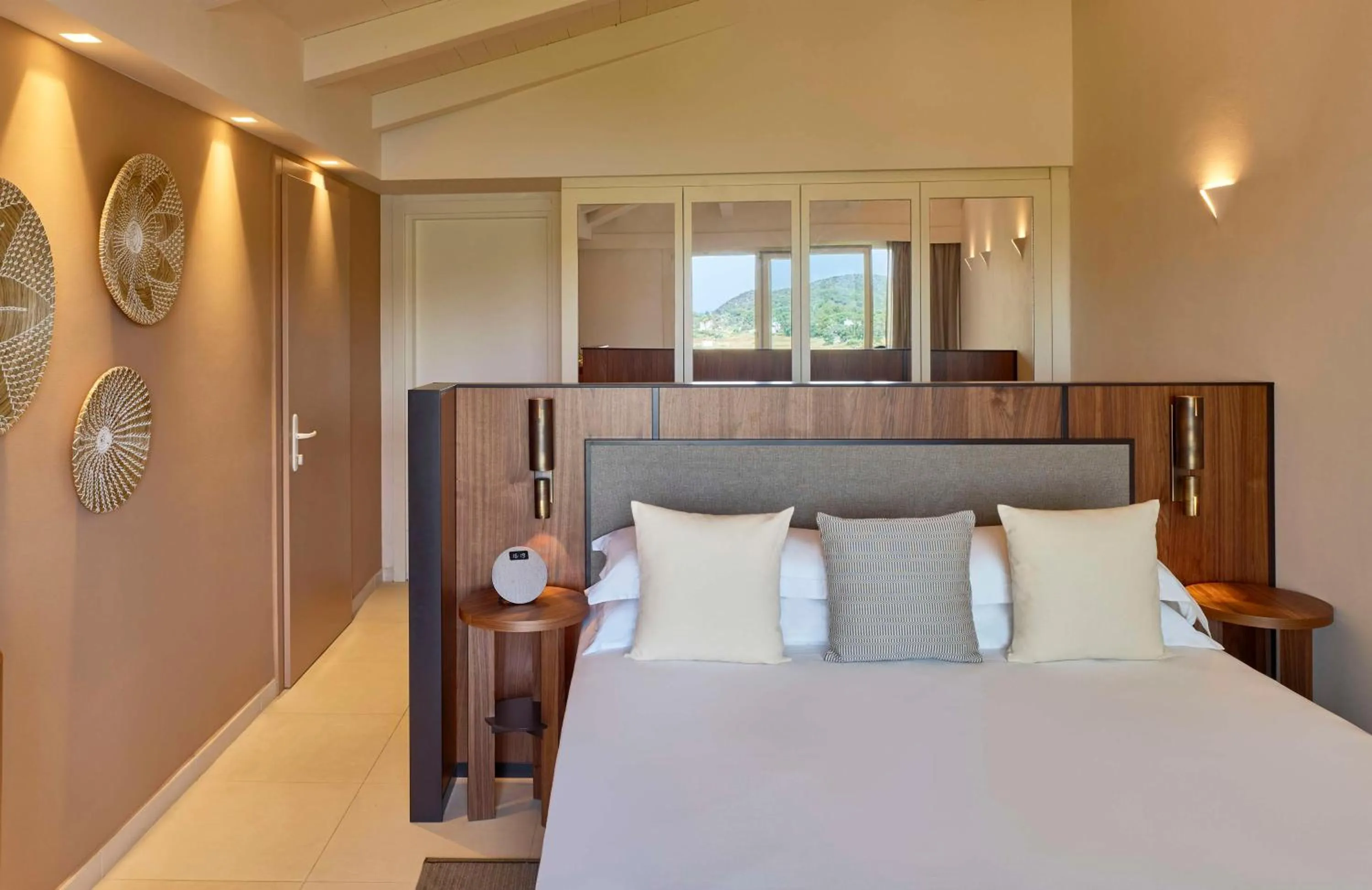 Bed in Baia Di Chia Resort Sardinia, Curio Collection By Hilton