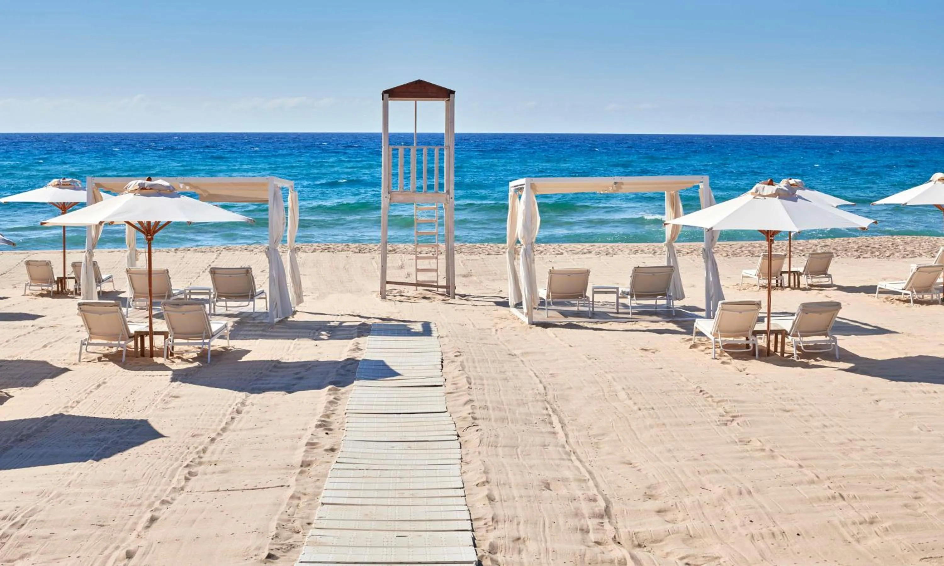 Property building in Baia Di Chia Resort Sardinia, Curio Collection By Hilton