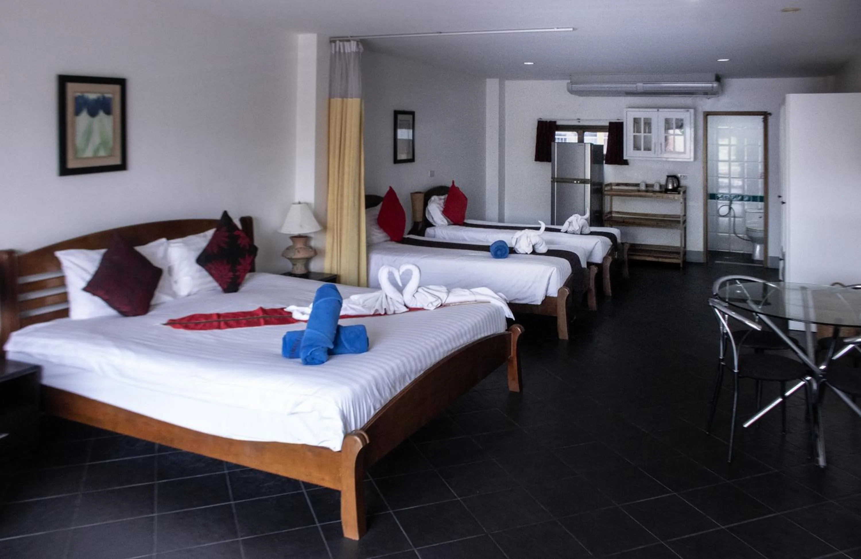 Bed in Deng's kamala beach Guesthouse