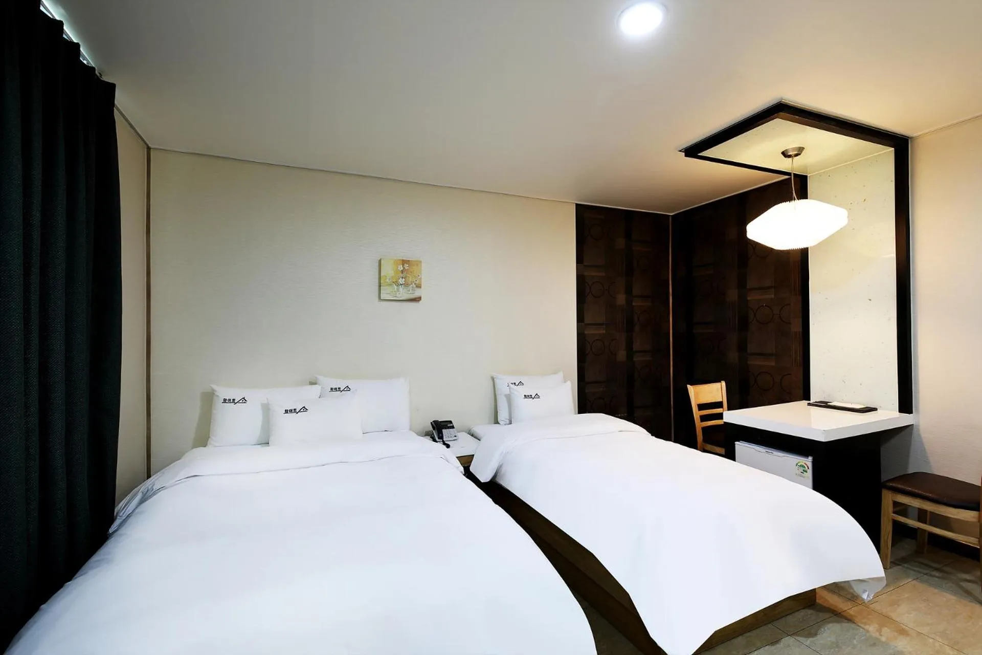 Bed in White Tourist Hotel