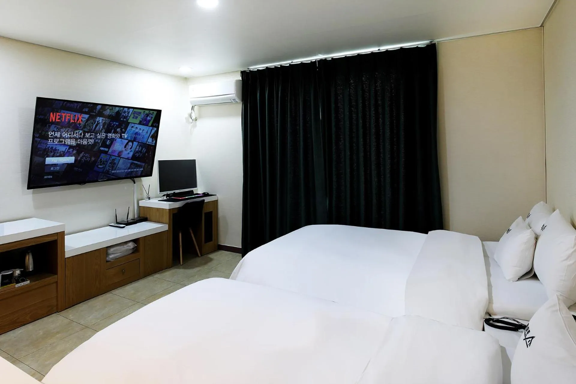 Bed in White Tourist Hotel