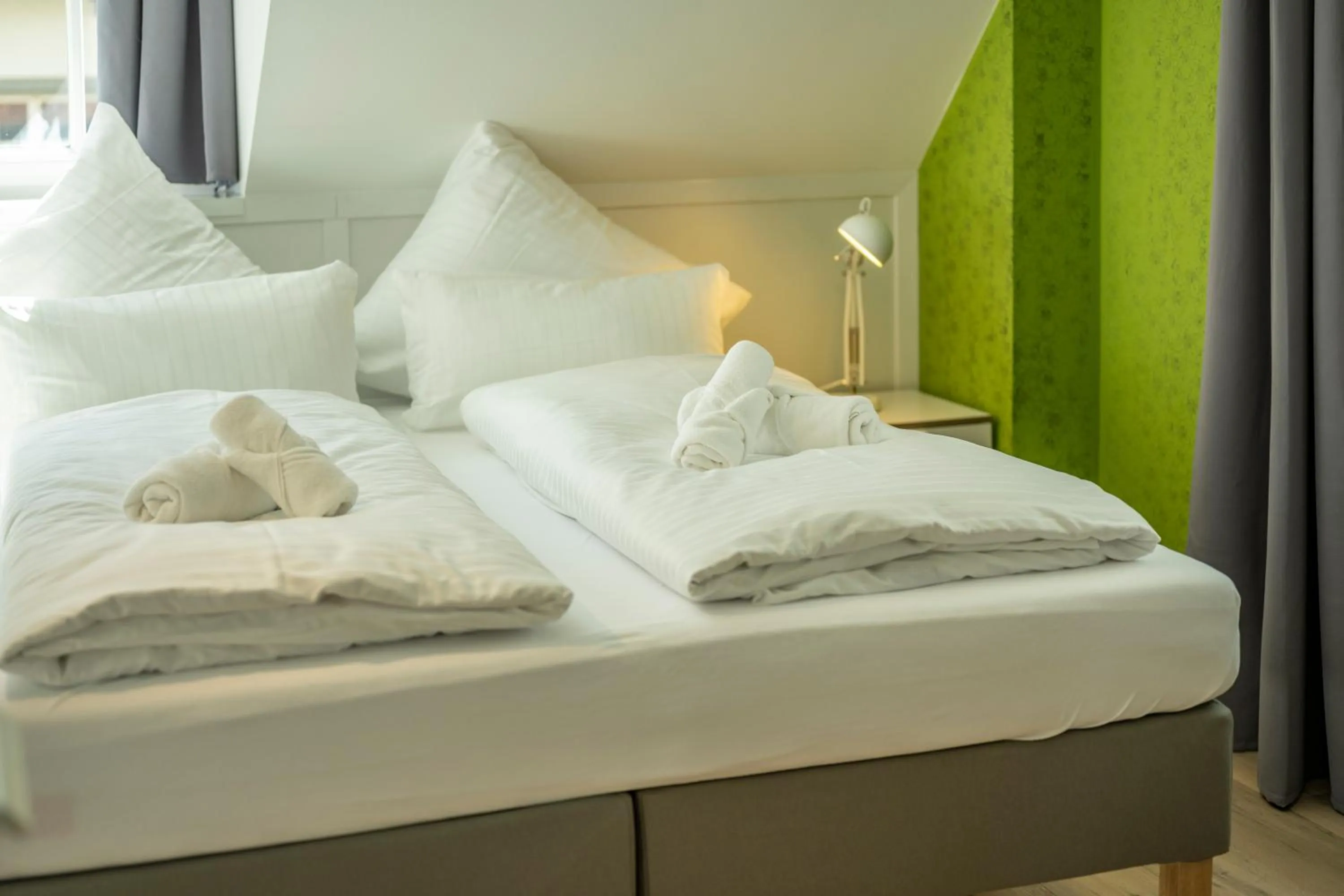 Bed in Gästehaus am Schlossplatz, Z. 4