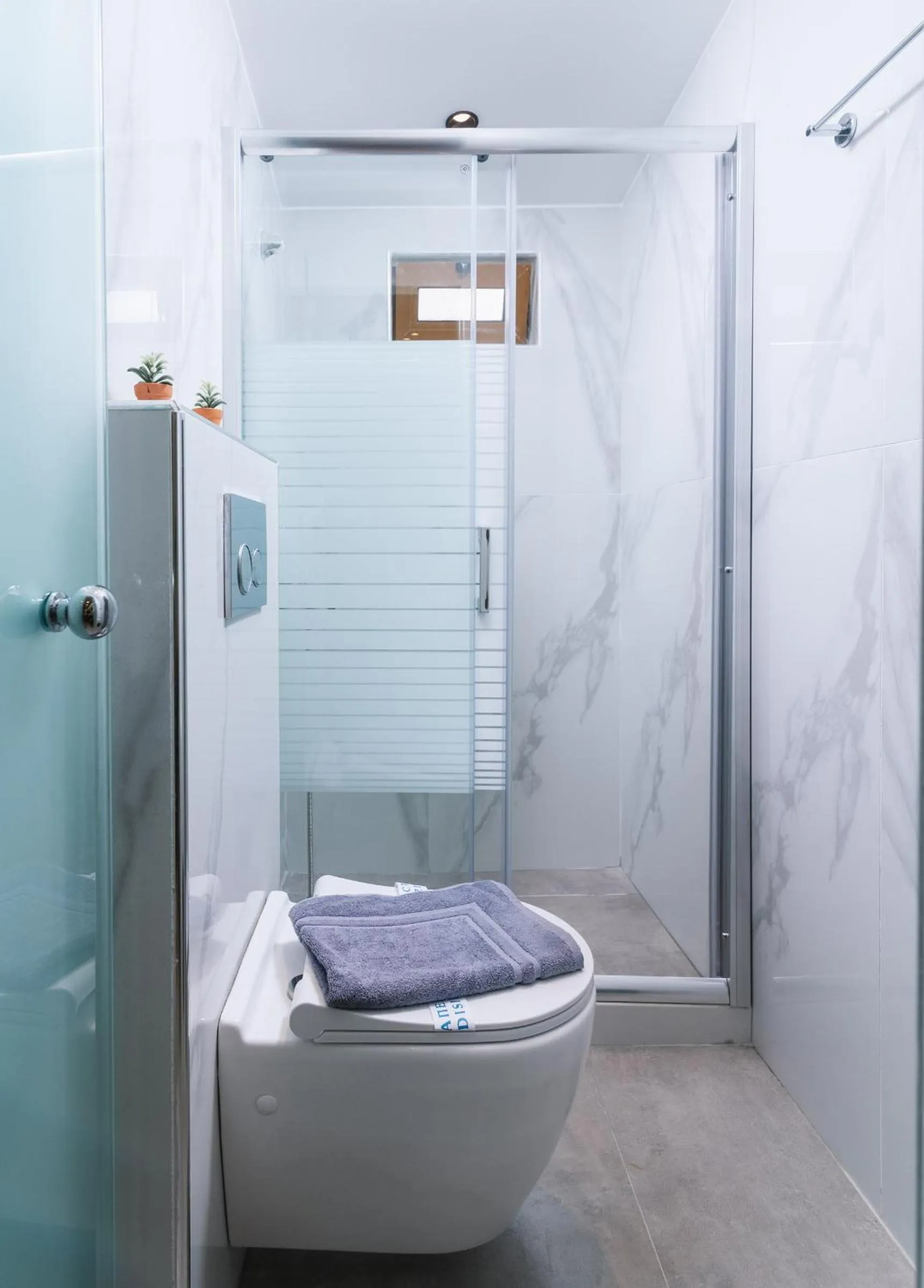 Shower in Alcyone Studios and Apartments
