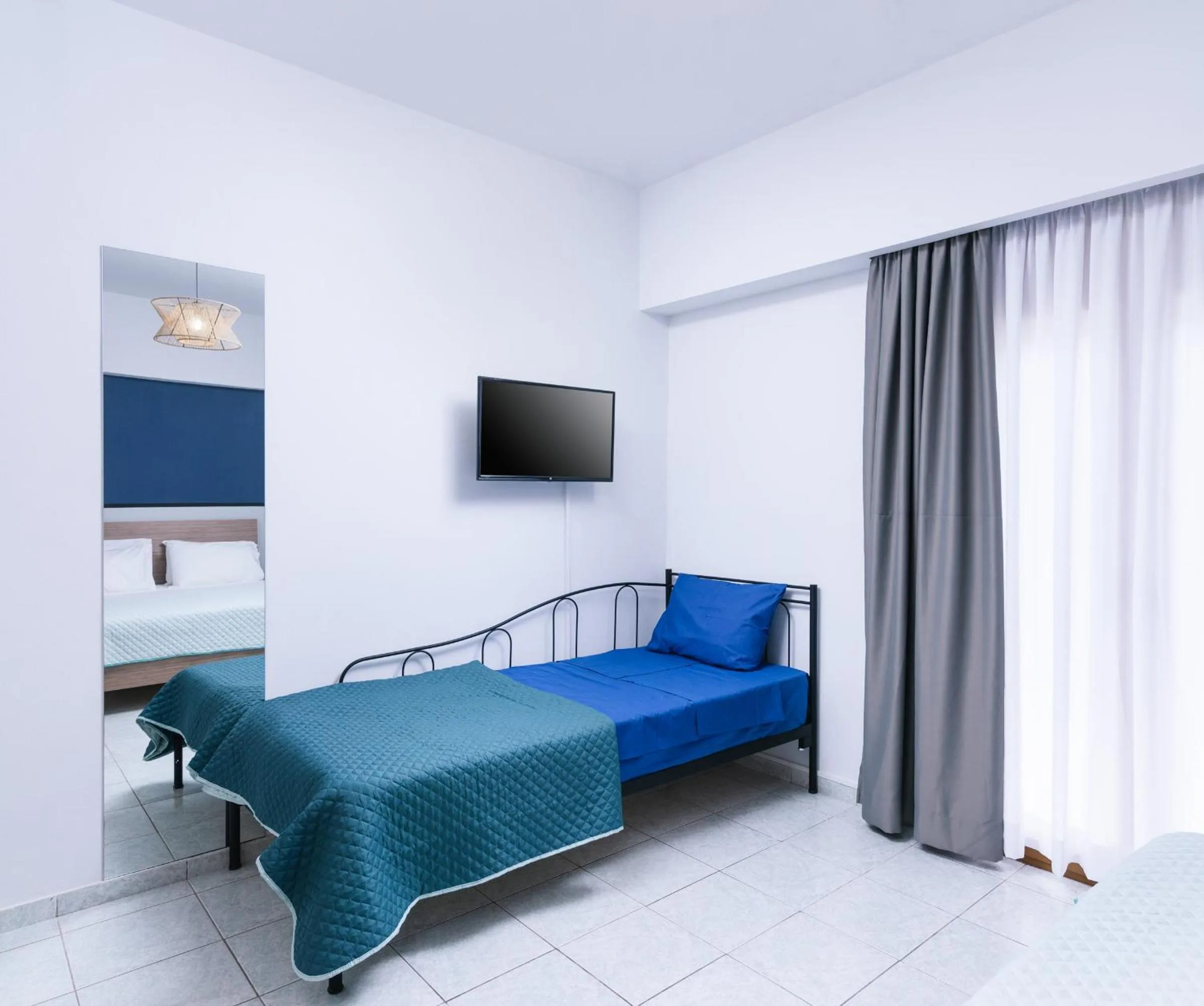 Bed in Alcyone Studios and Apartments