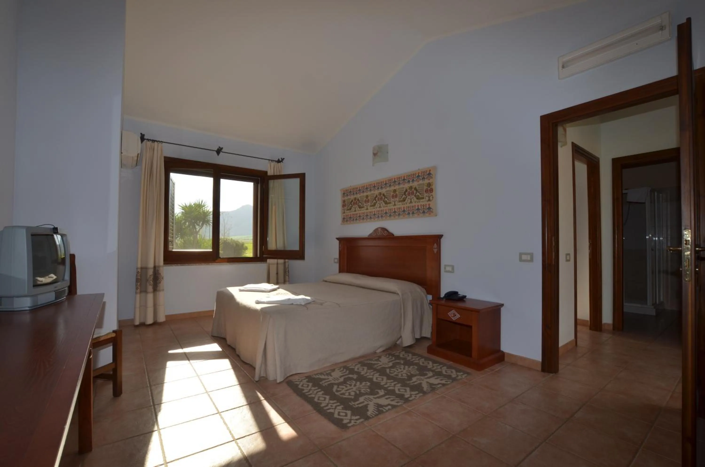 Bedroom in Albergo Ristorante Pizzeria Monte Arcosu