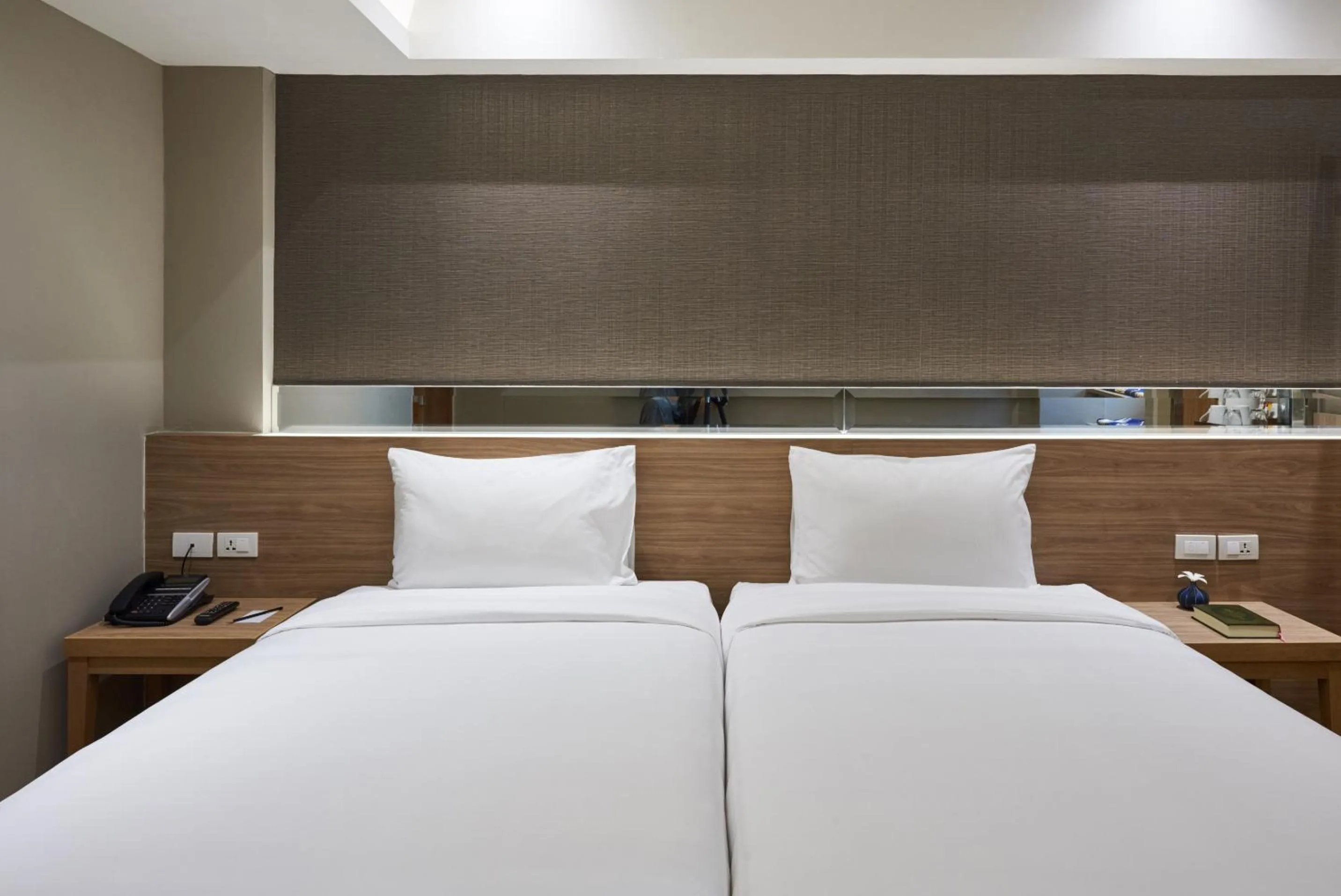 Bed in Almas Hotel Bangkok