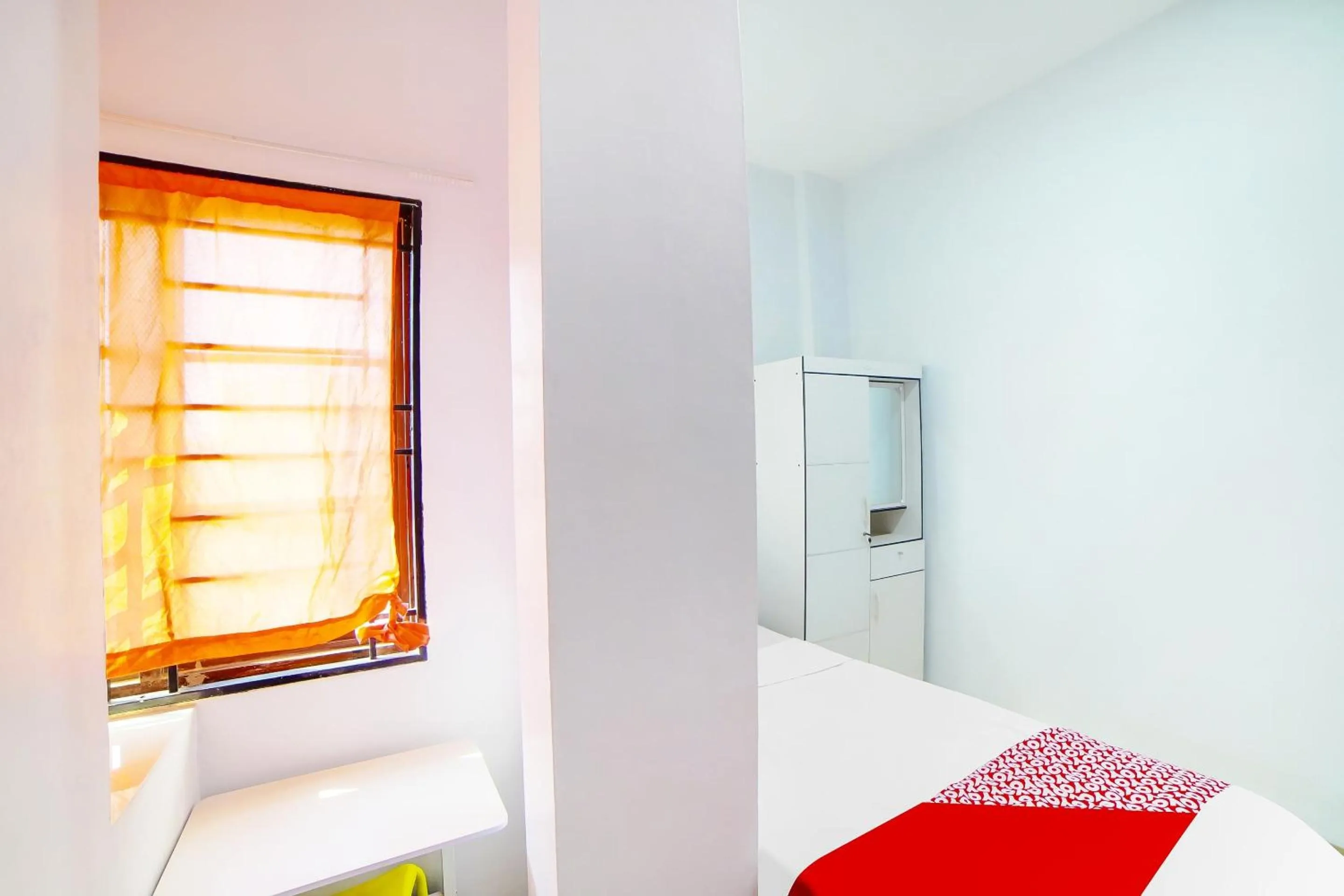 Bedroom in OYO 91283 Sg Premium Guest House