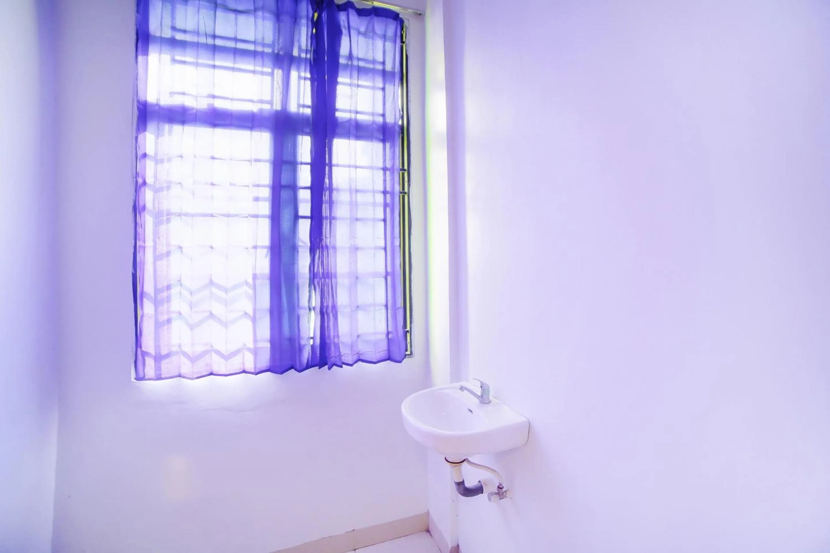 Bedroom in OYO 91283 Sg Premium Guest House