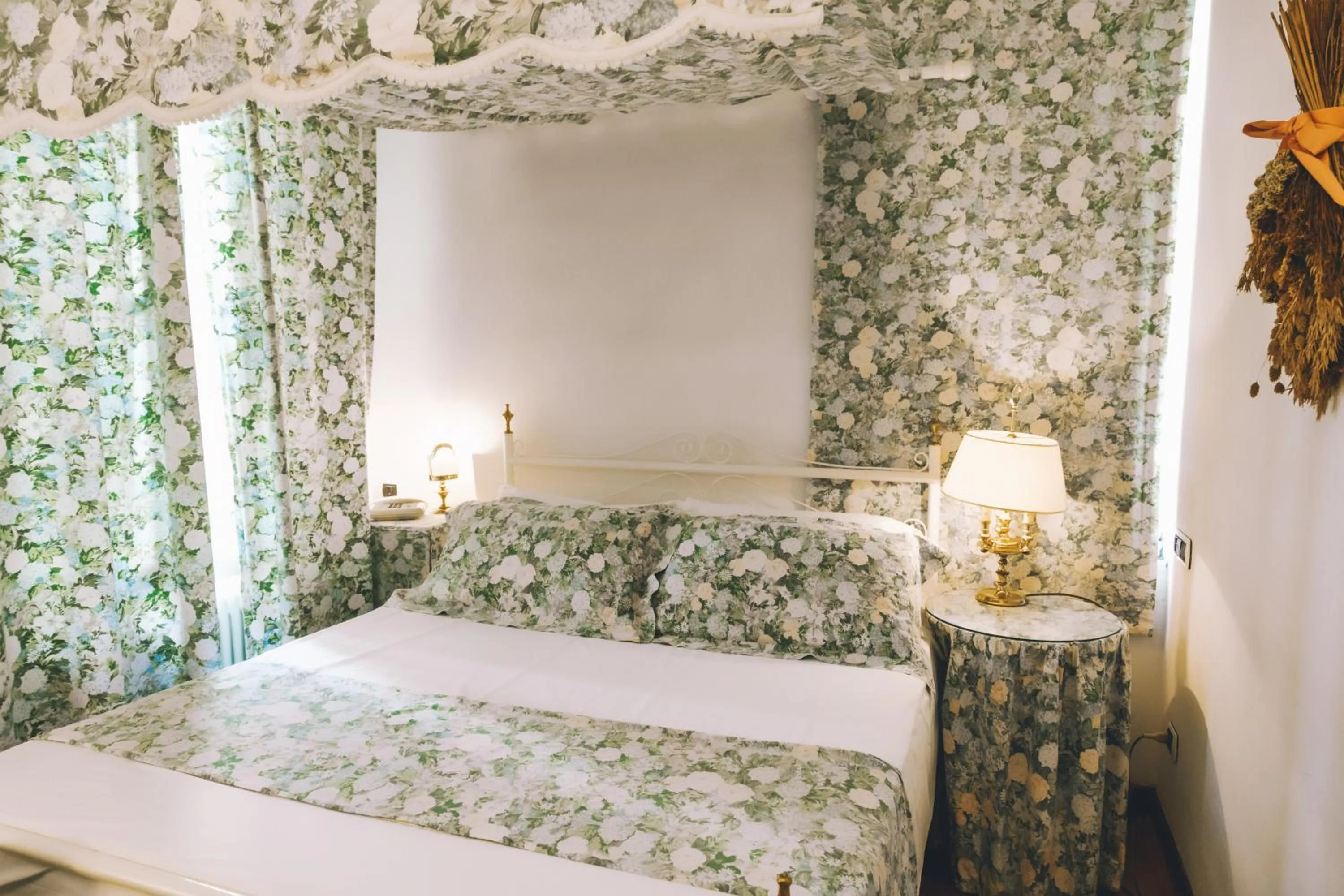 Bed in Eveline Portosole Hotel