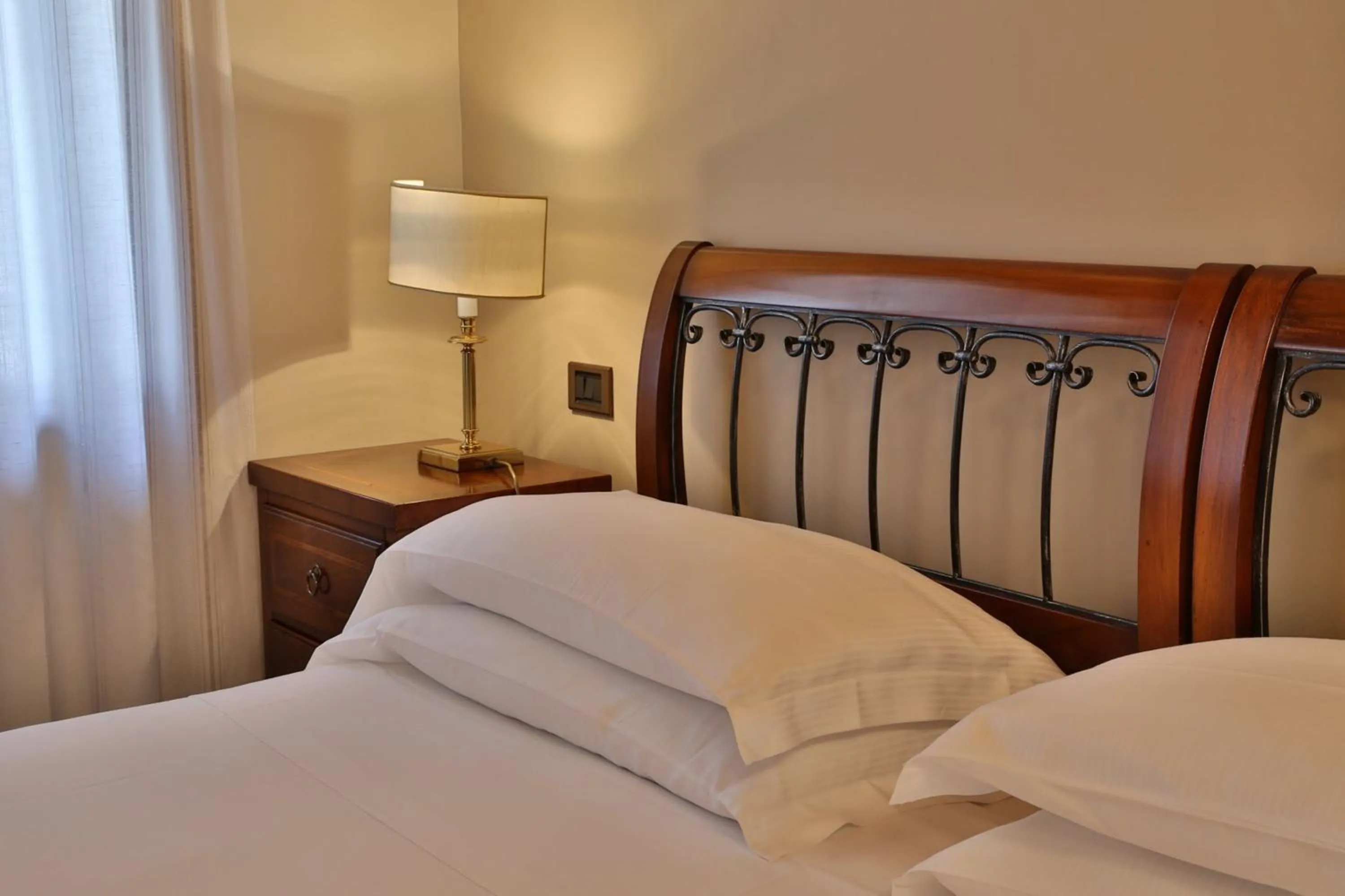 Decorative detail, Bed in Hotel Canon d'Oro