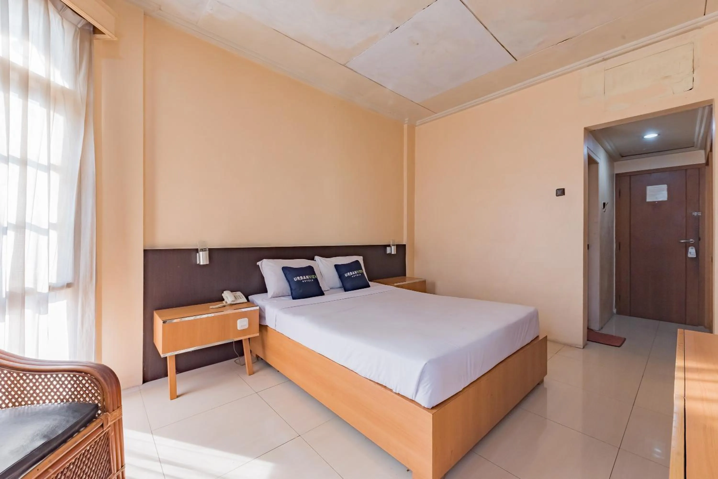 Bedroom, Bed in Urbanview Hotel Crown Tasikmalaya by RedDoorz