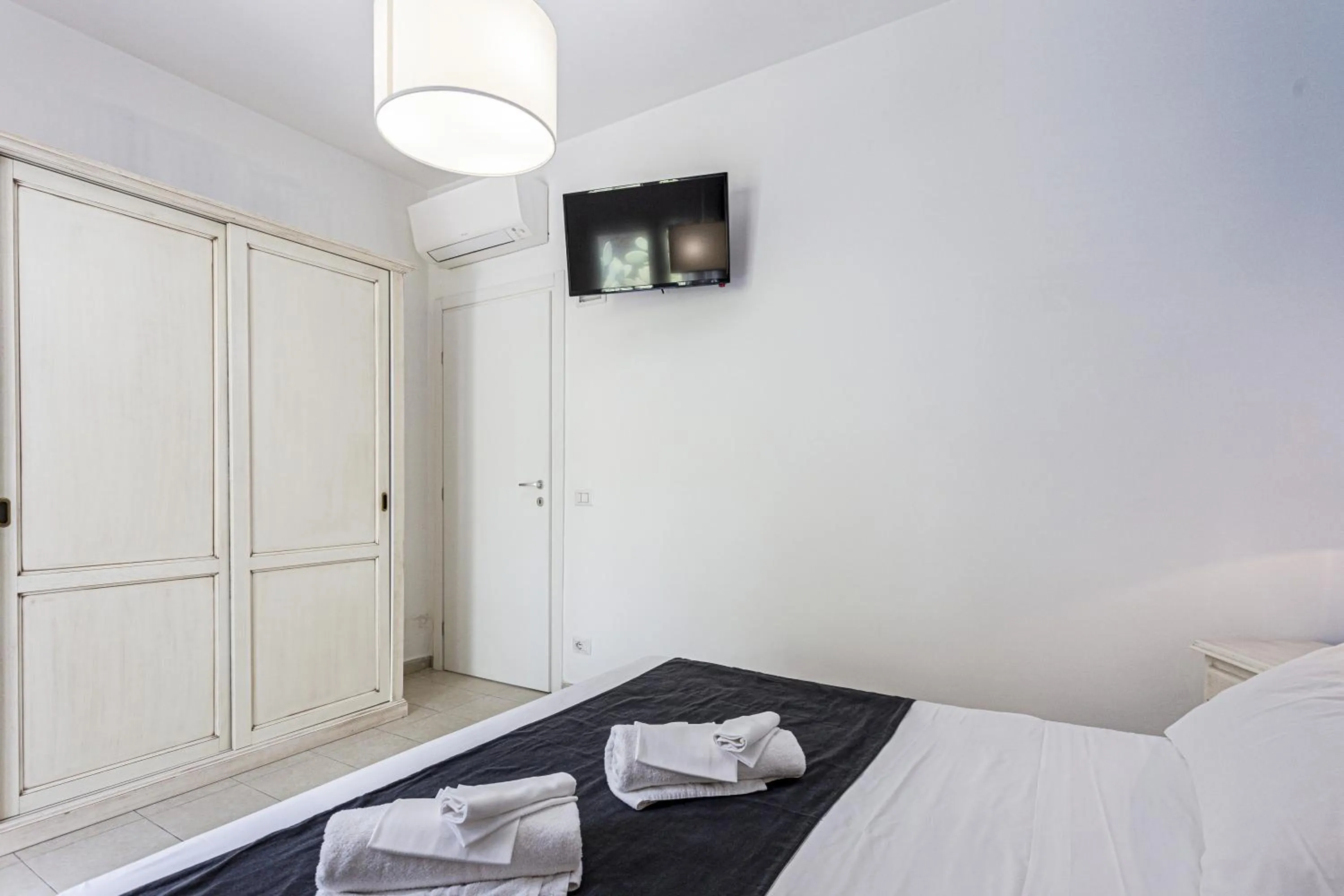 Bed in Stella del mare Apartments