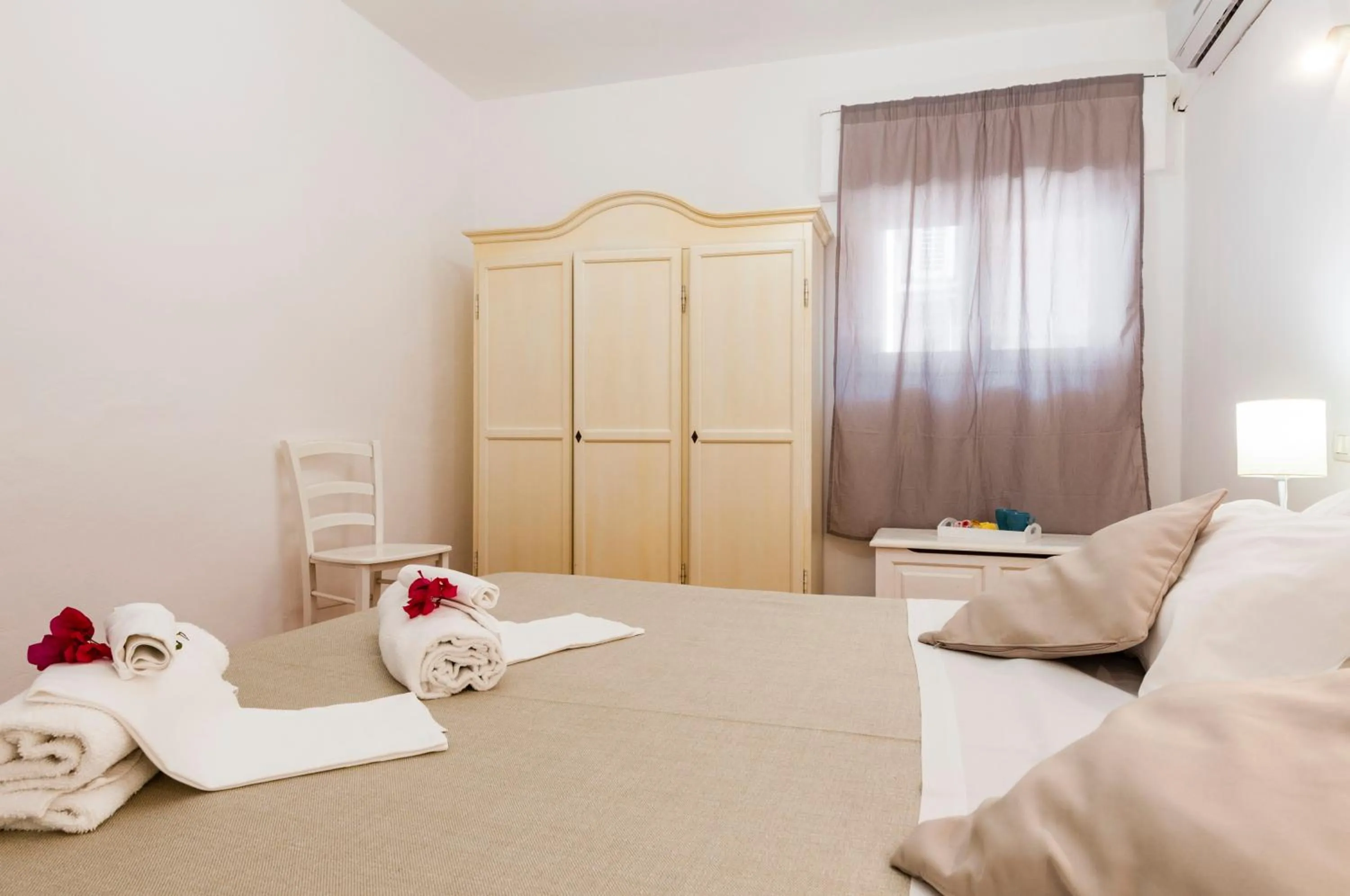 Bed in Stella del mare Apartments