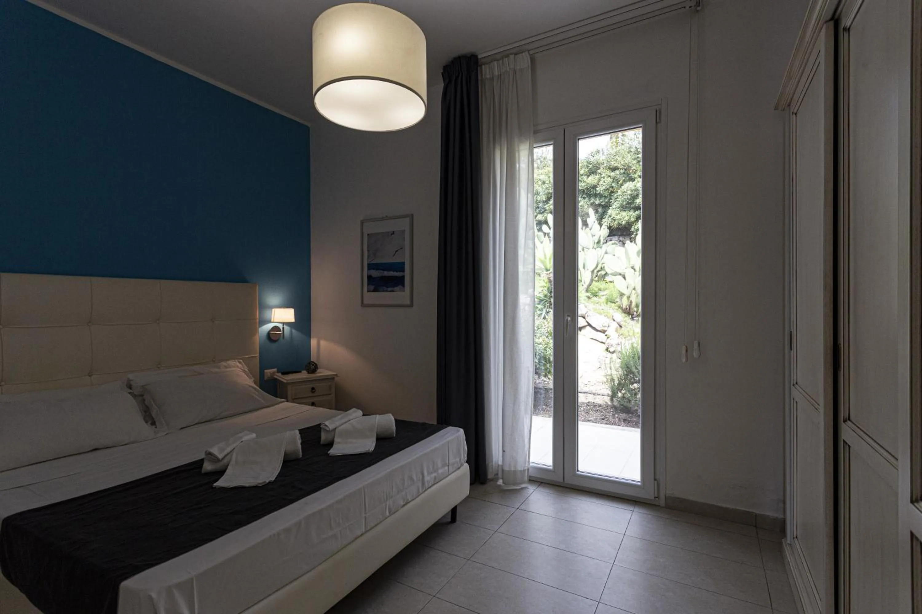 Bed in Stella del mare Apartments