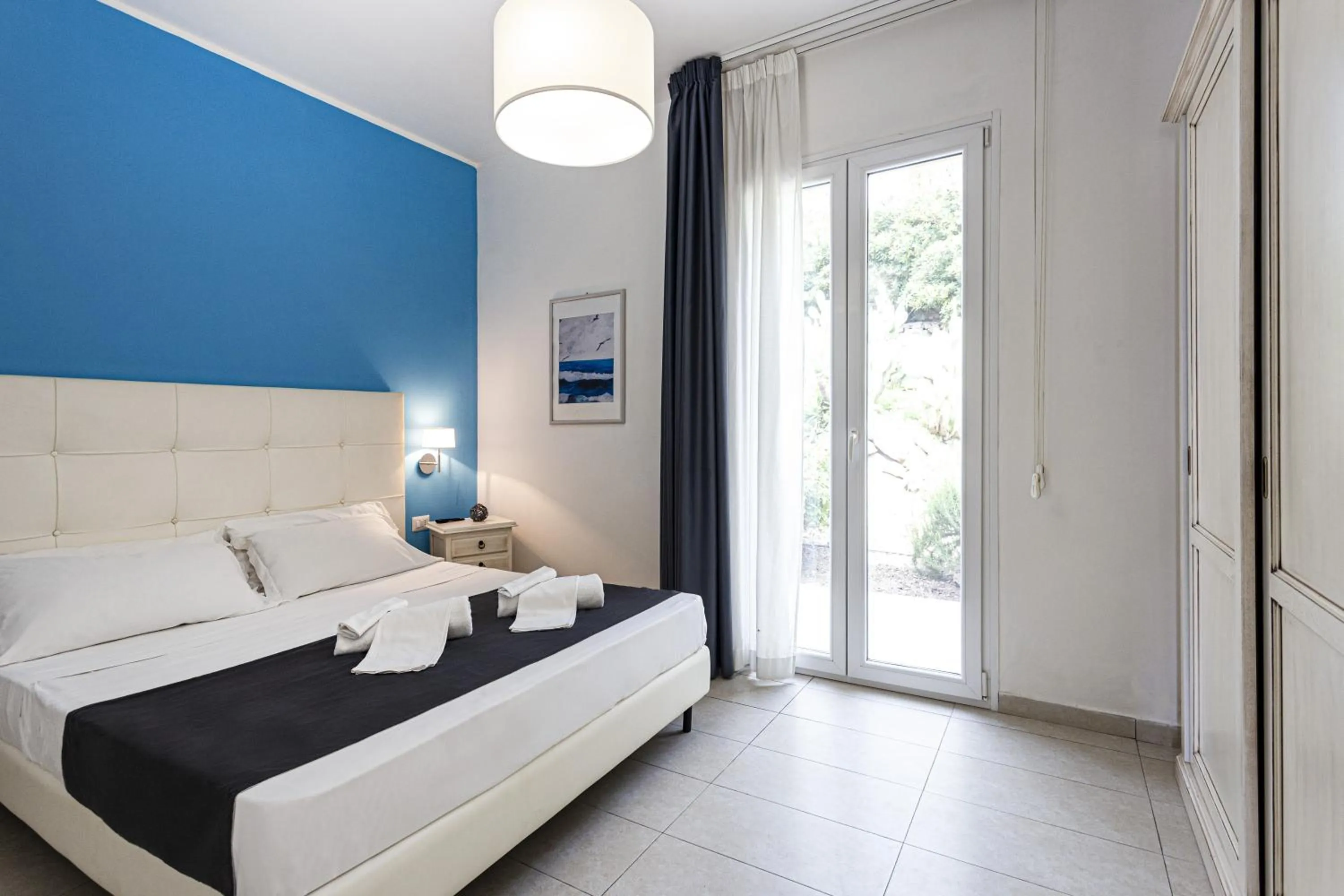 Bed in Stella del mare Apartments