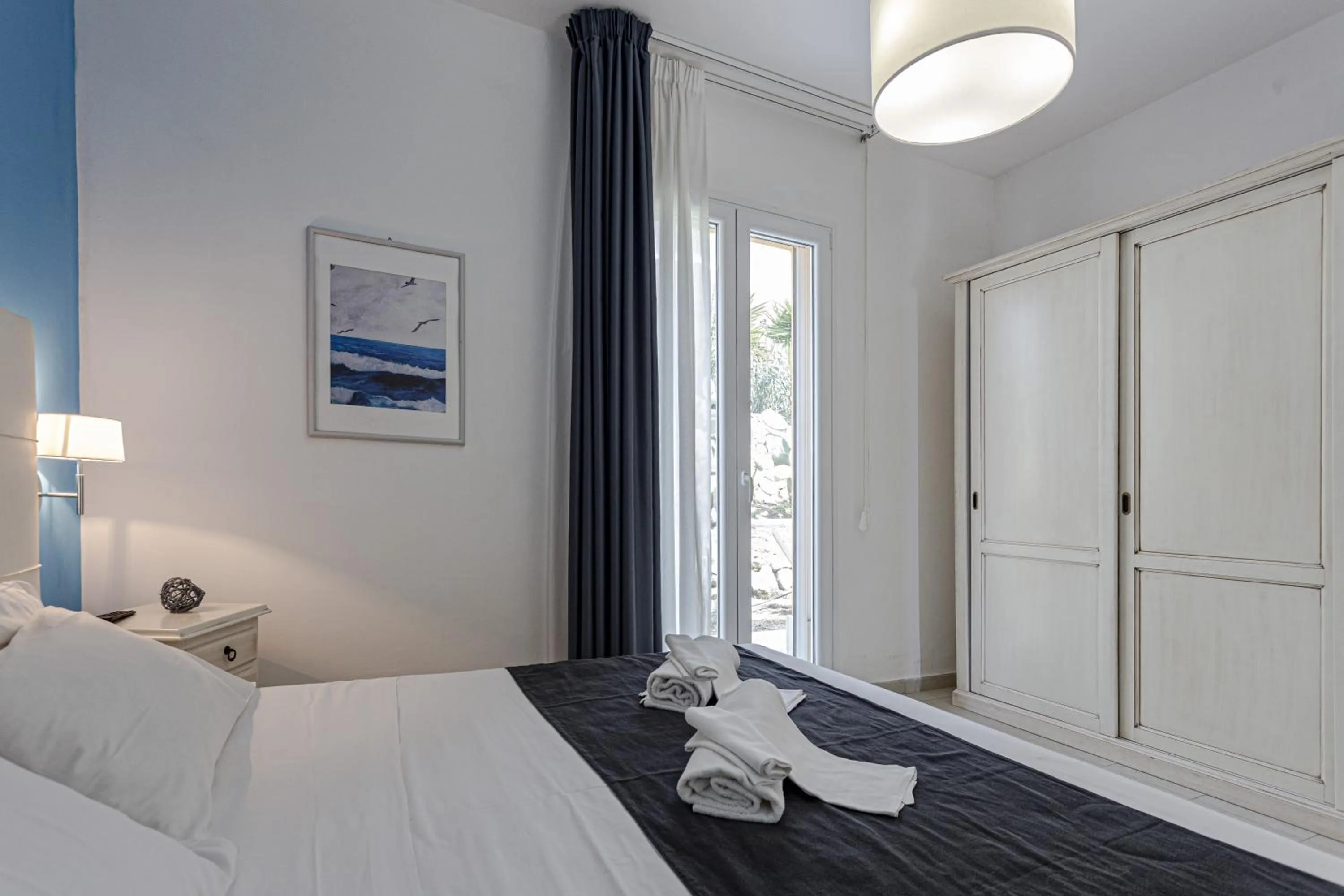 Bed in Stella del mare Apartments