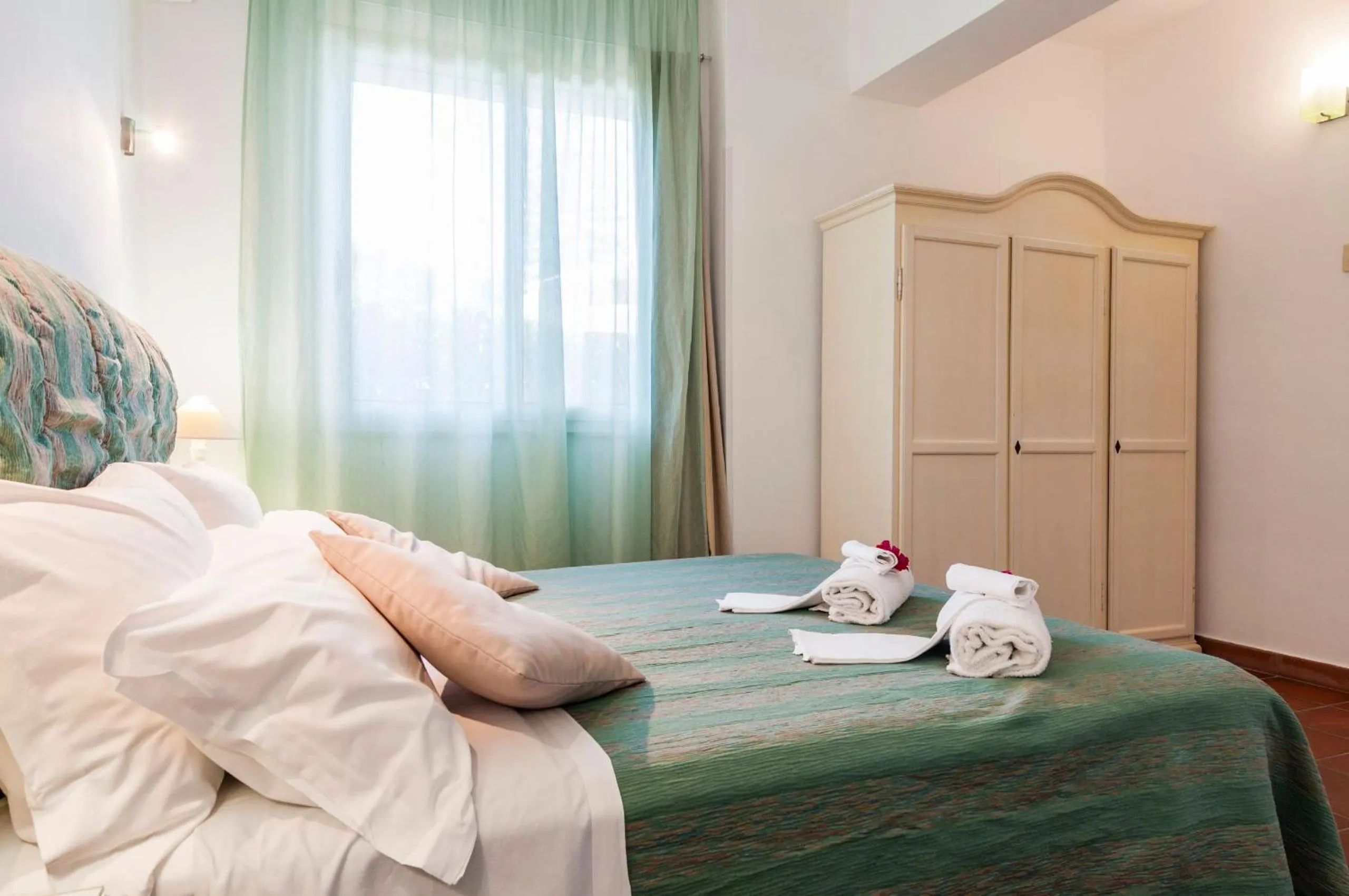 Bed in Stella del mare Apartments