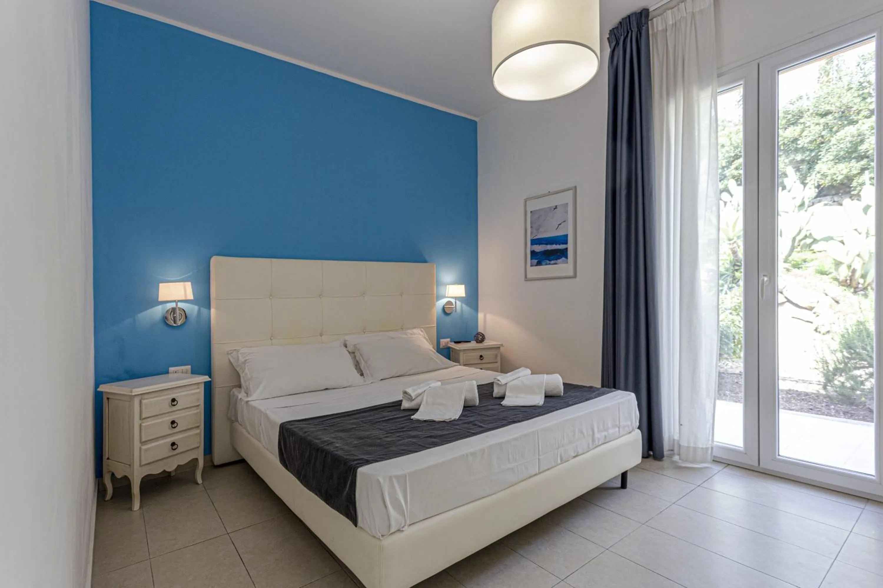 Bed in Stella del mare Apartments