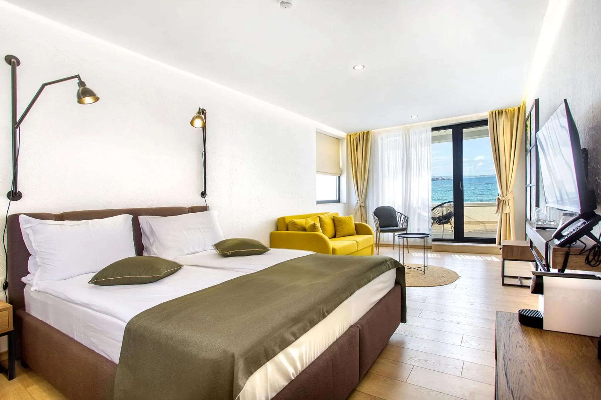 Communal lounge/ TV room, Bed in Olive Villas Beach Hotel