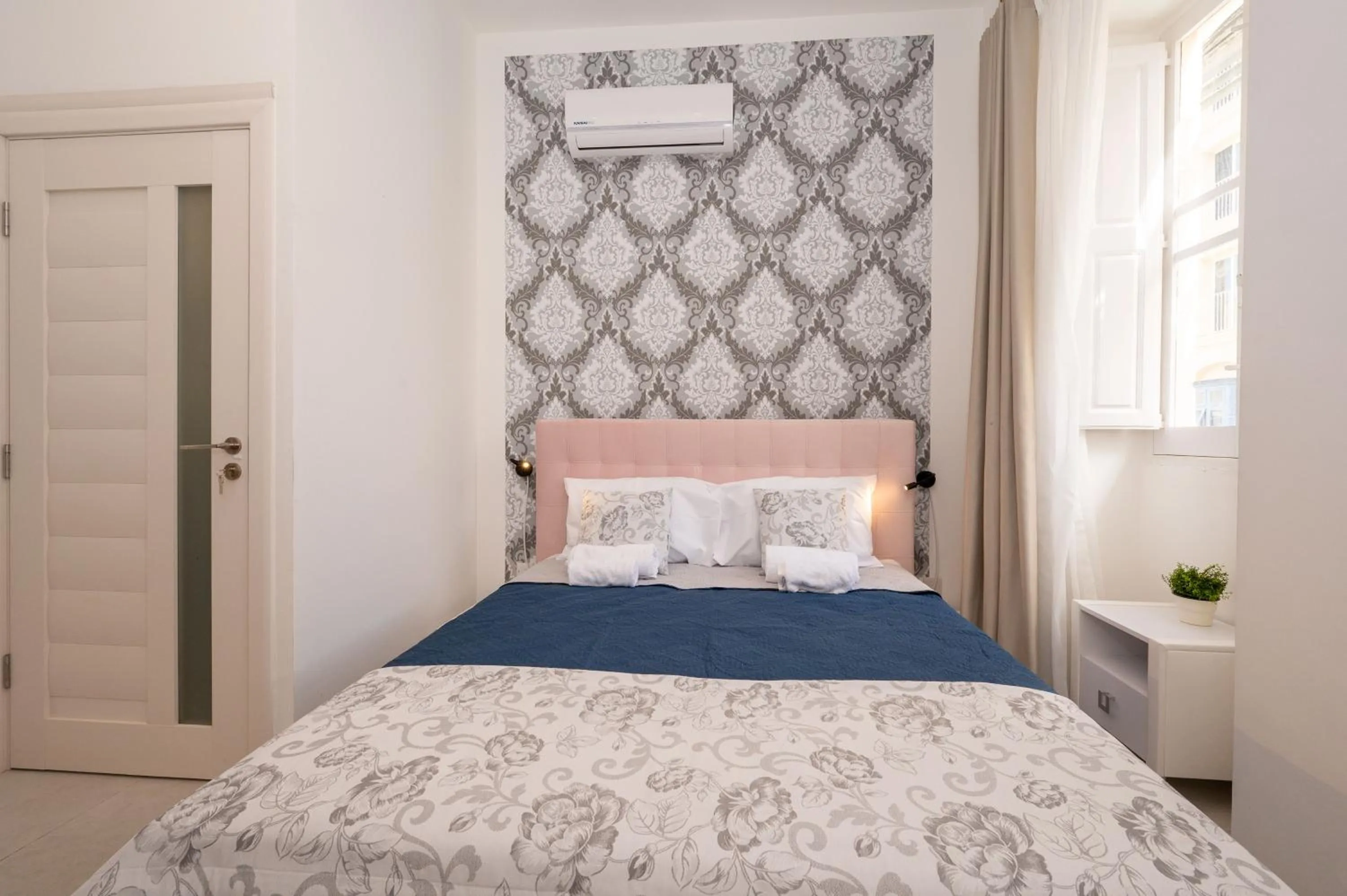 Bed in Vela Blu Boutique Suites