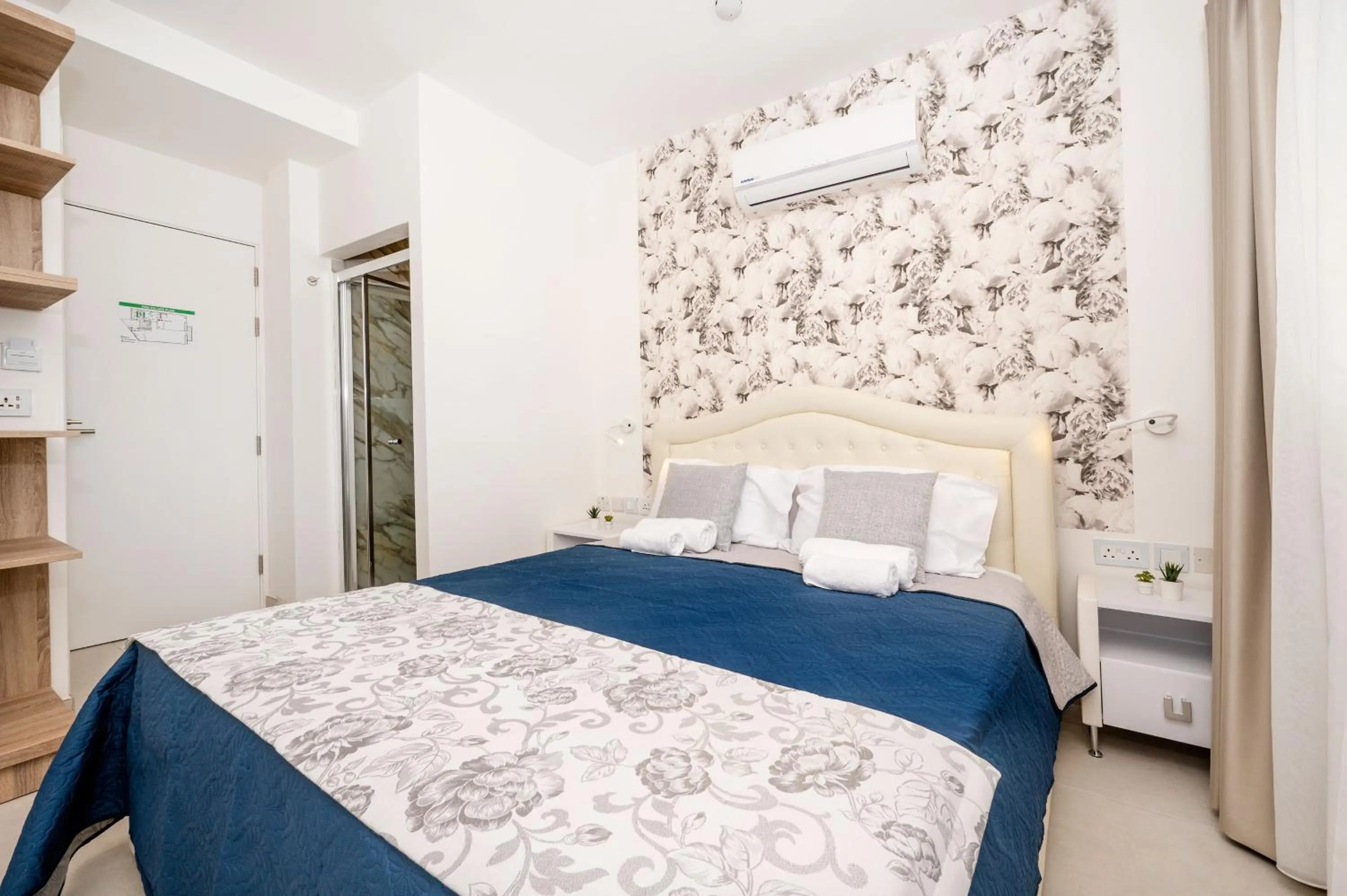 Bed in Vela Blu Boutique Suites