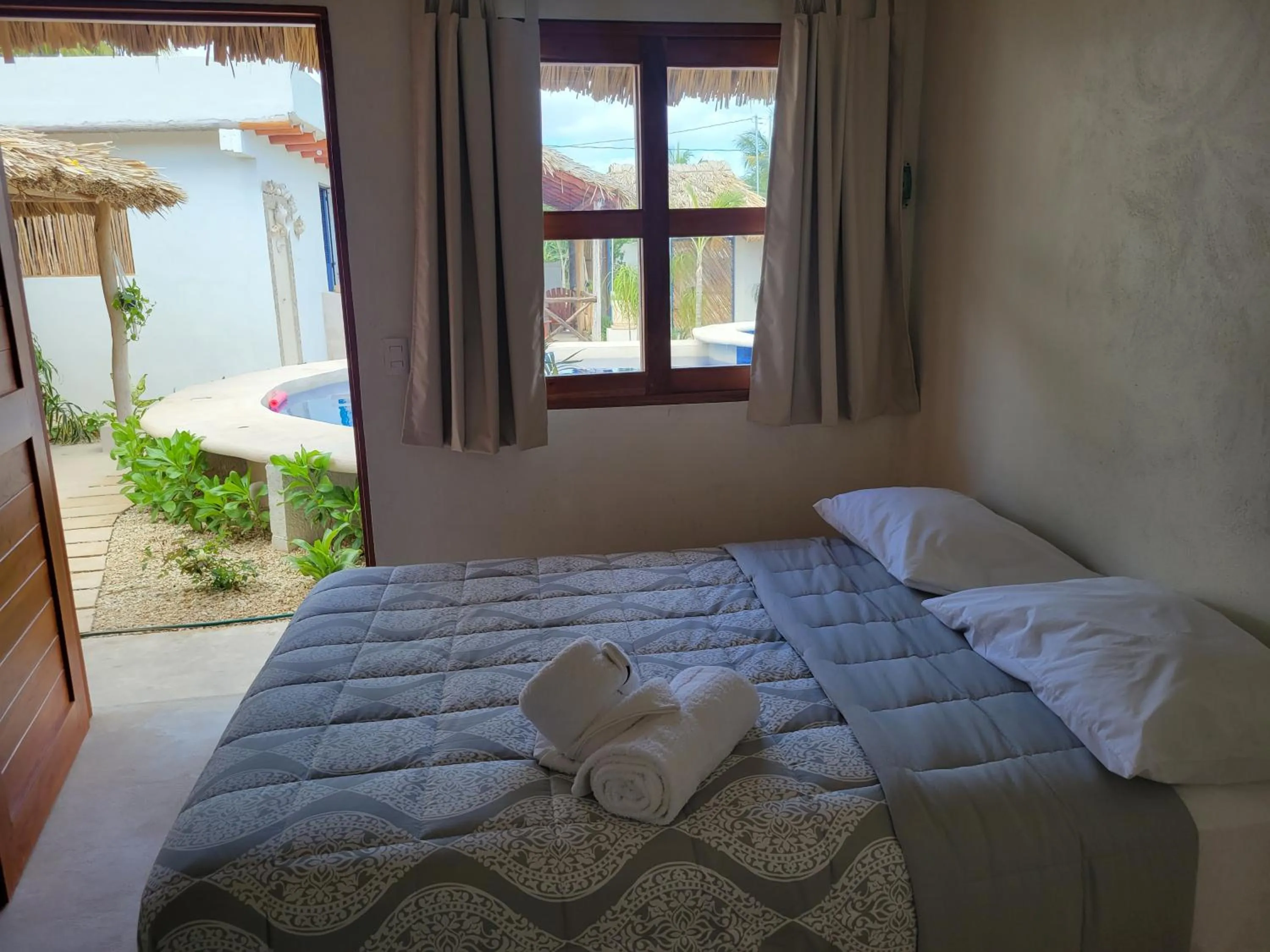 Pool view, Bed in Villas Ixchel