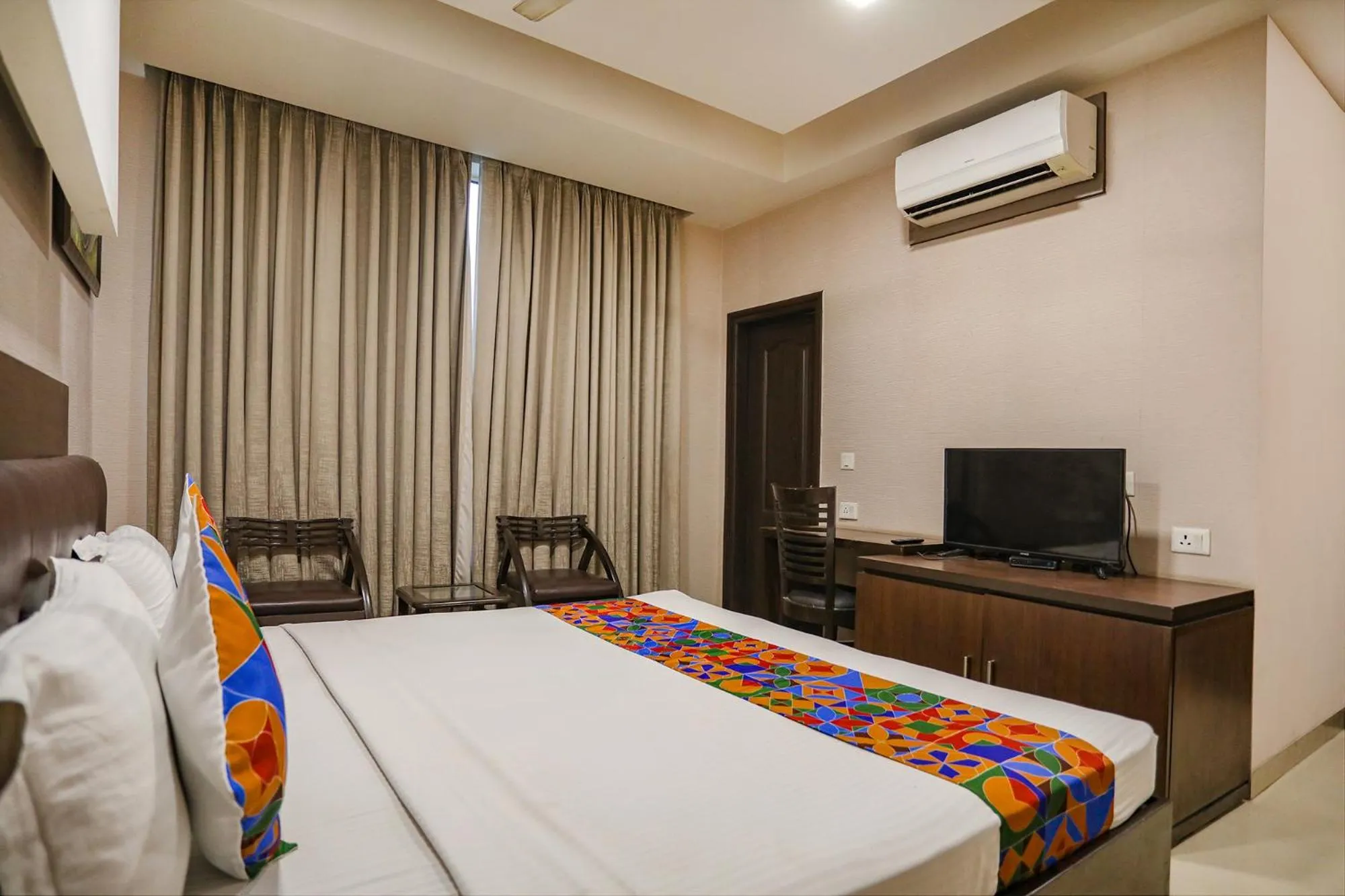 Bed in FabHotel Grand Olive