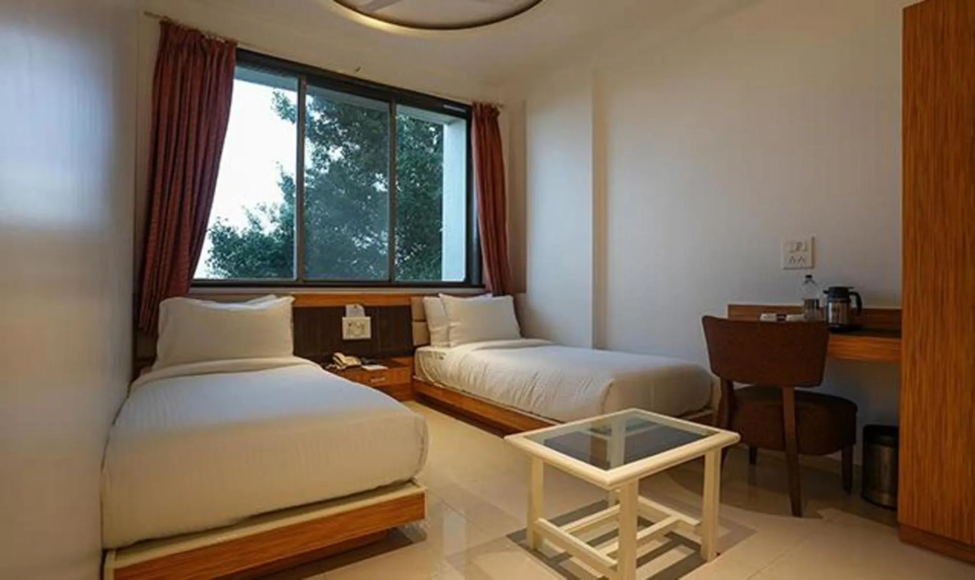 Bed in FabHotel Prime Rester Select Chakan