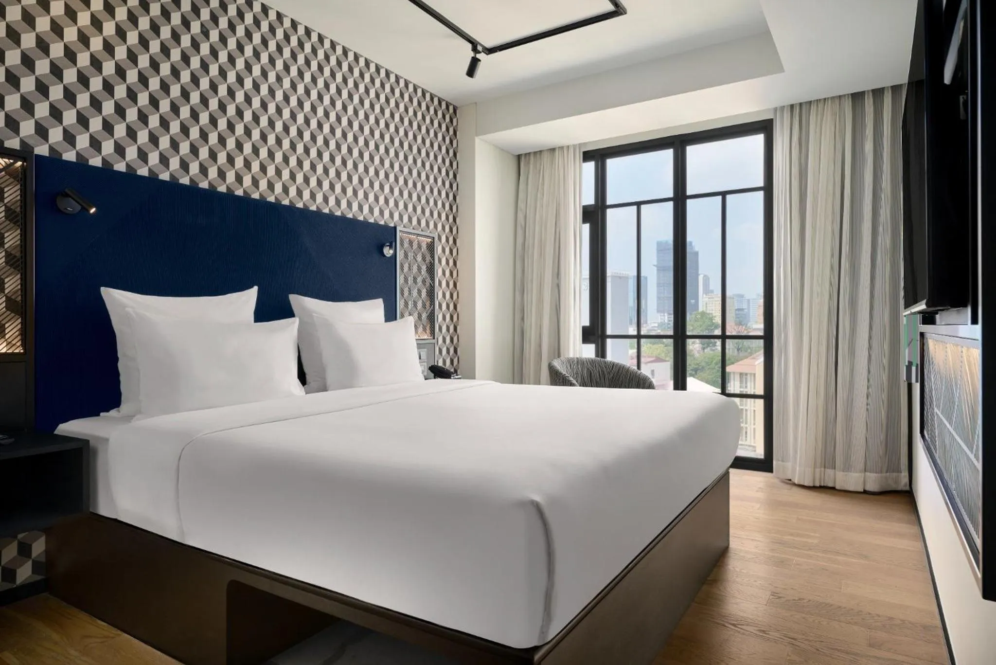 Bed in TRIBE Phnom Penh Post Office