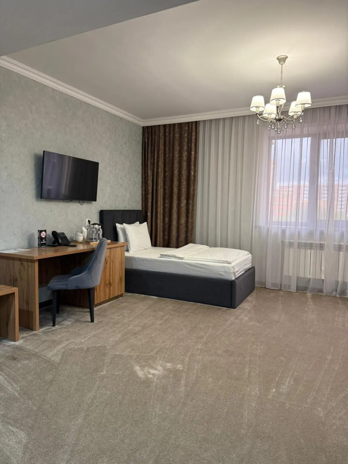 Bed in MirOtel Hotel