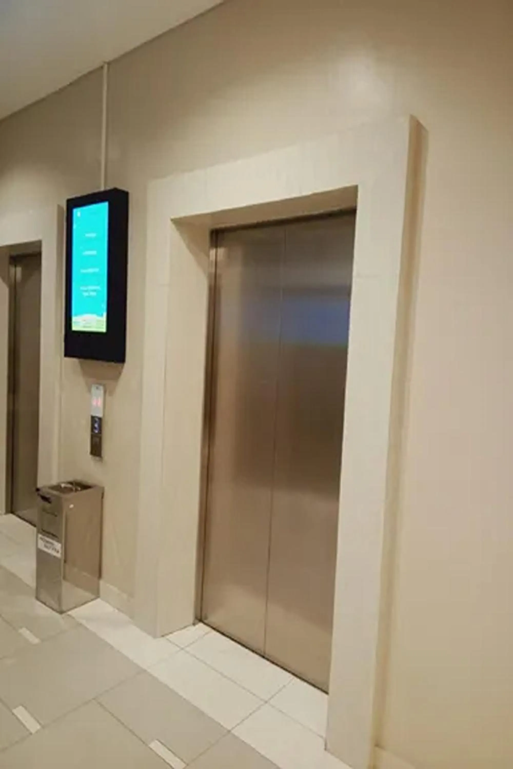 elevator in Velito at Podomoro Golf View Apartment