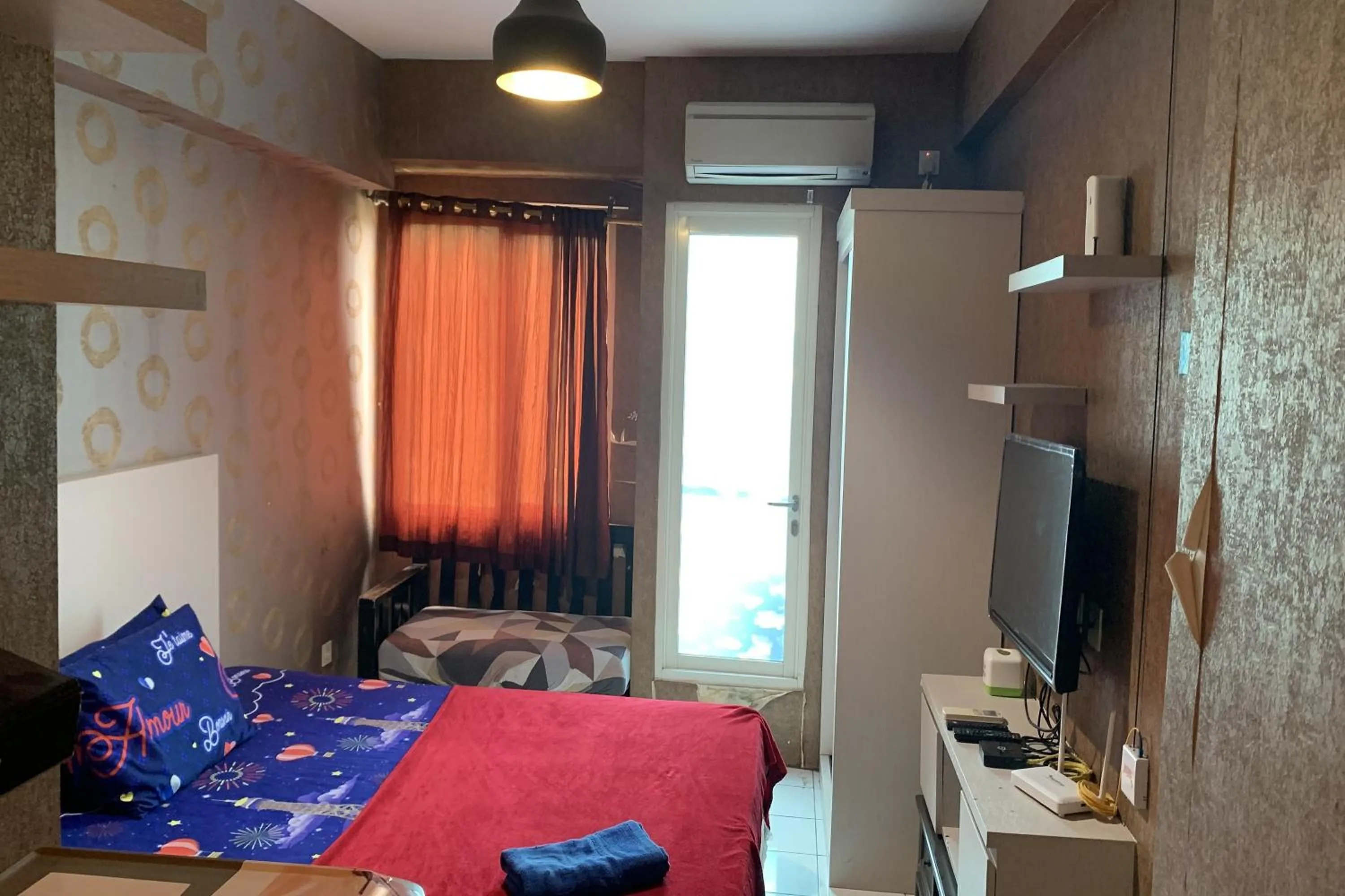 Bedroom, Bed in Velito at Podomoro Golf View Apartment