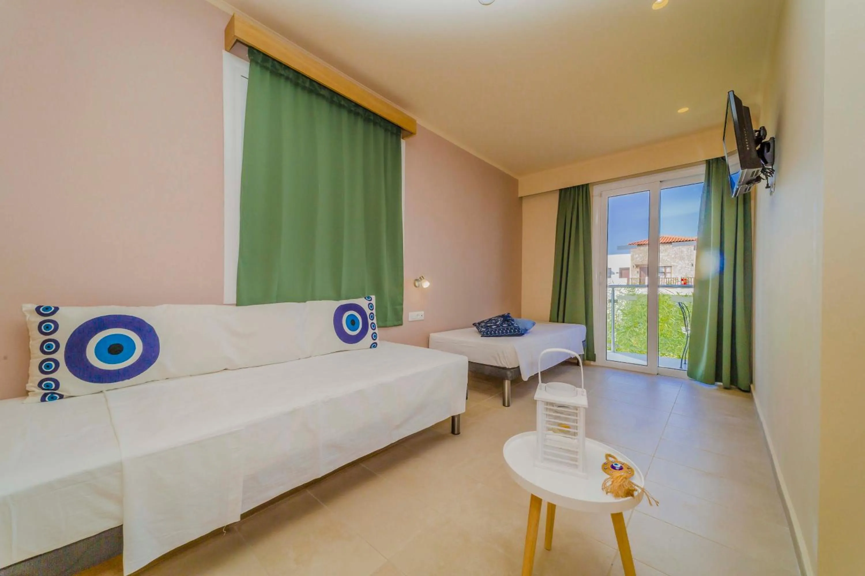 Seating area, Bed in Amaryllis front beach hotel