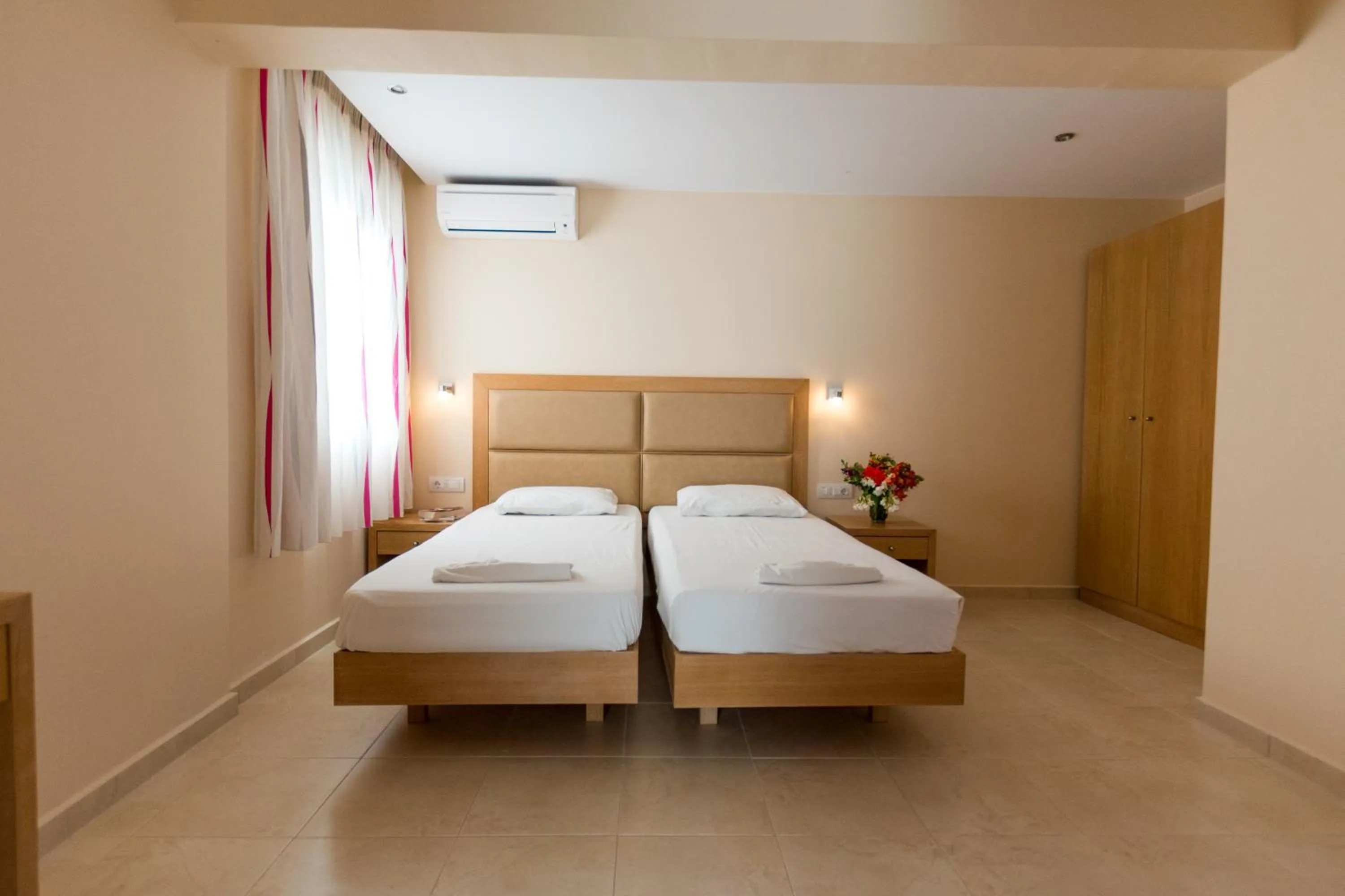 Bed in Amaryllis front beach hotel