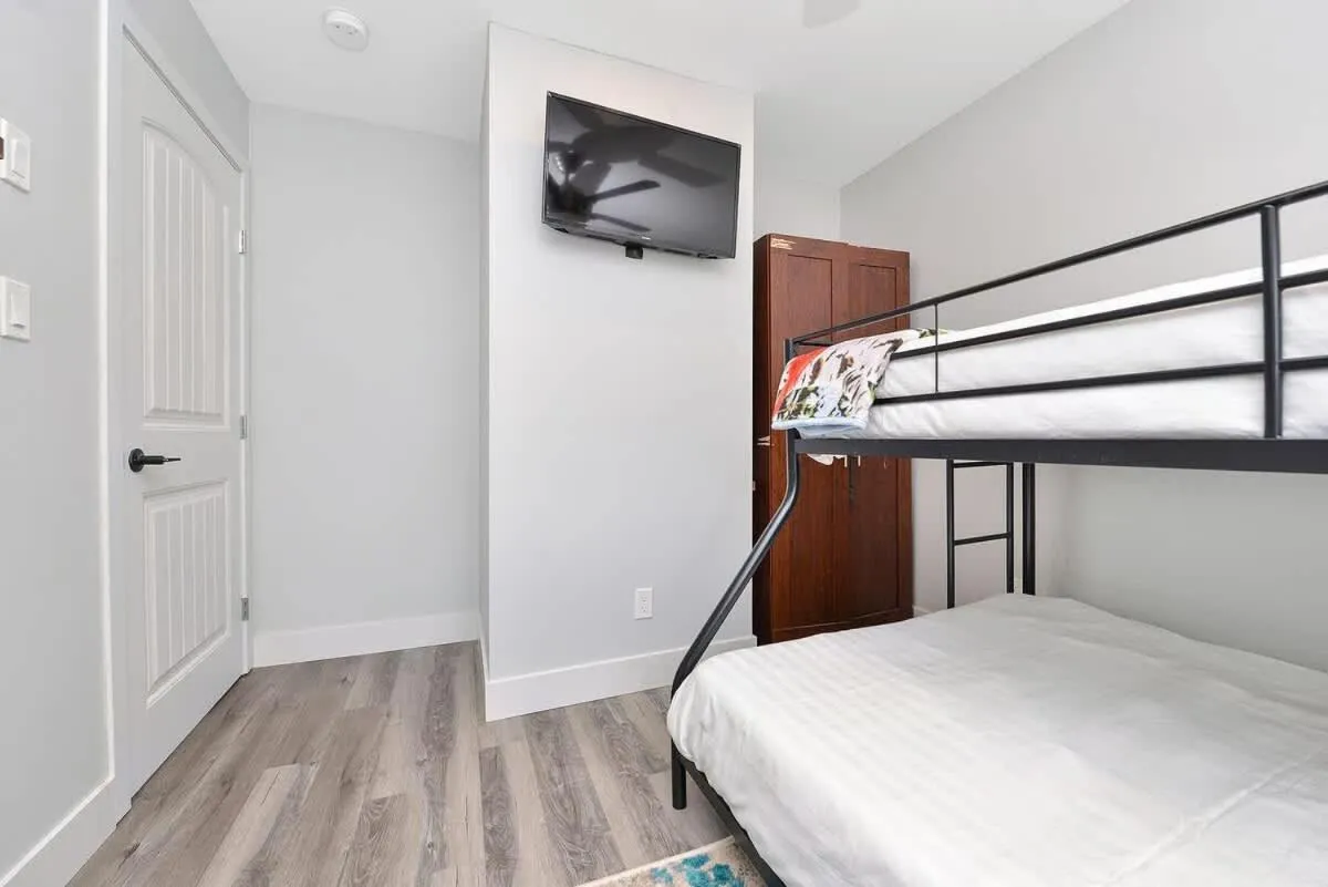 Bed in Dragonfly Cottage by EMR Vacation Rentals