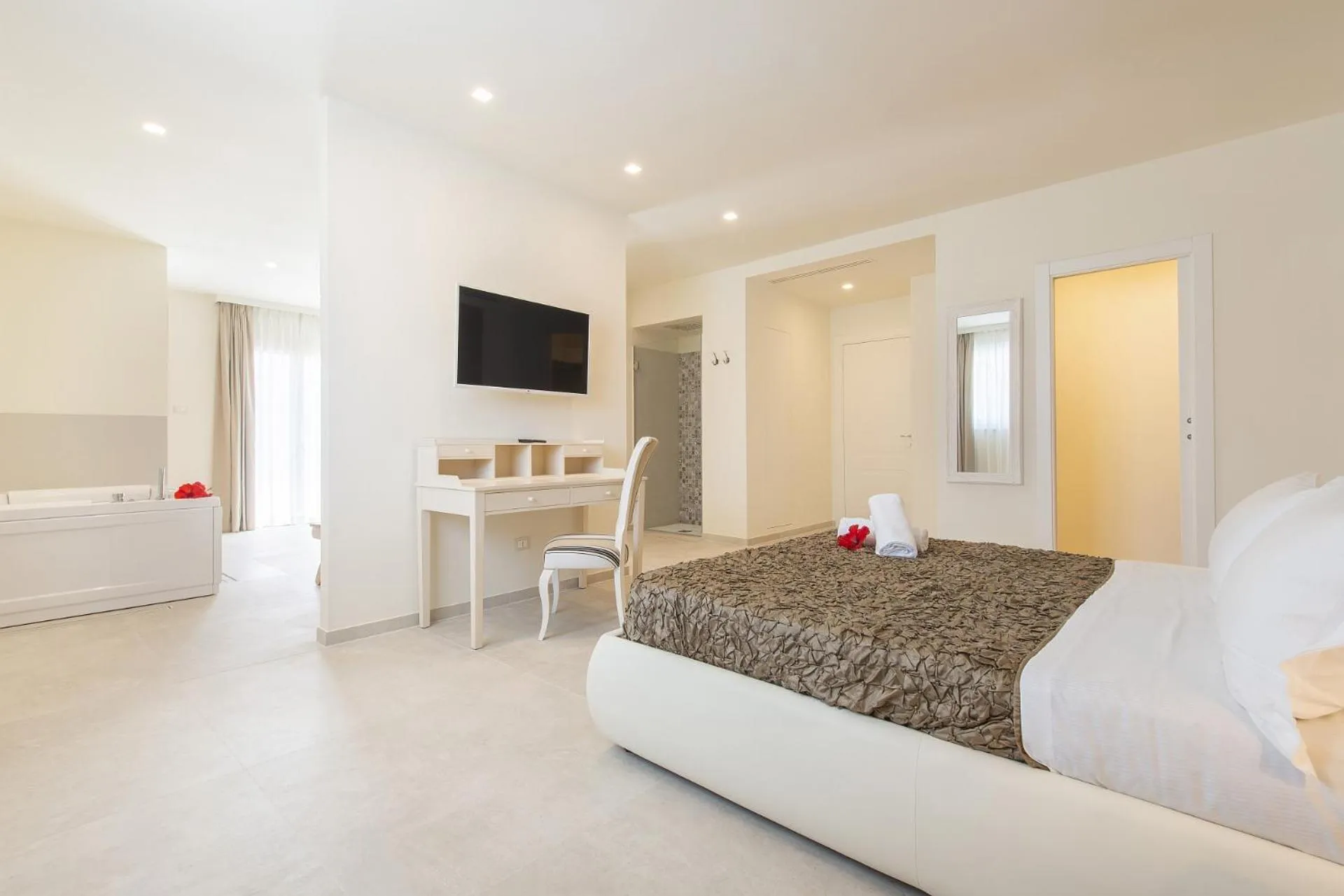 Bed in Hotel Giardino Suites&Spa