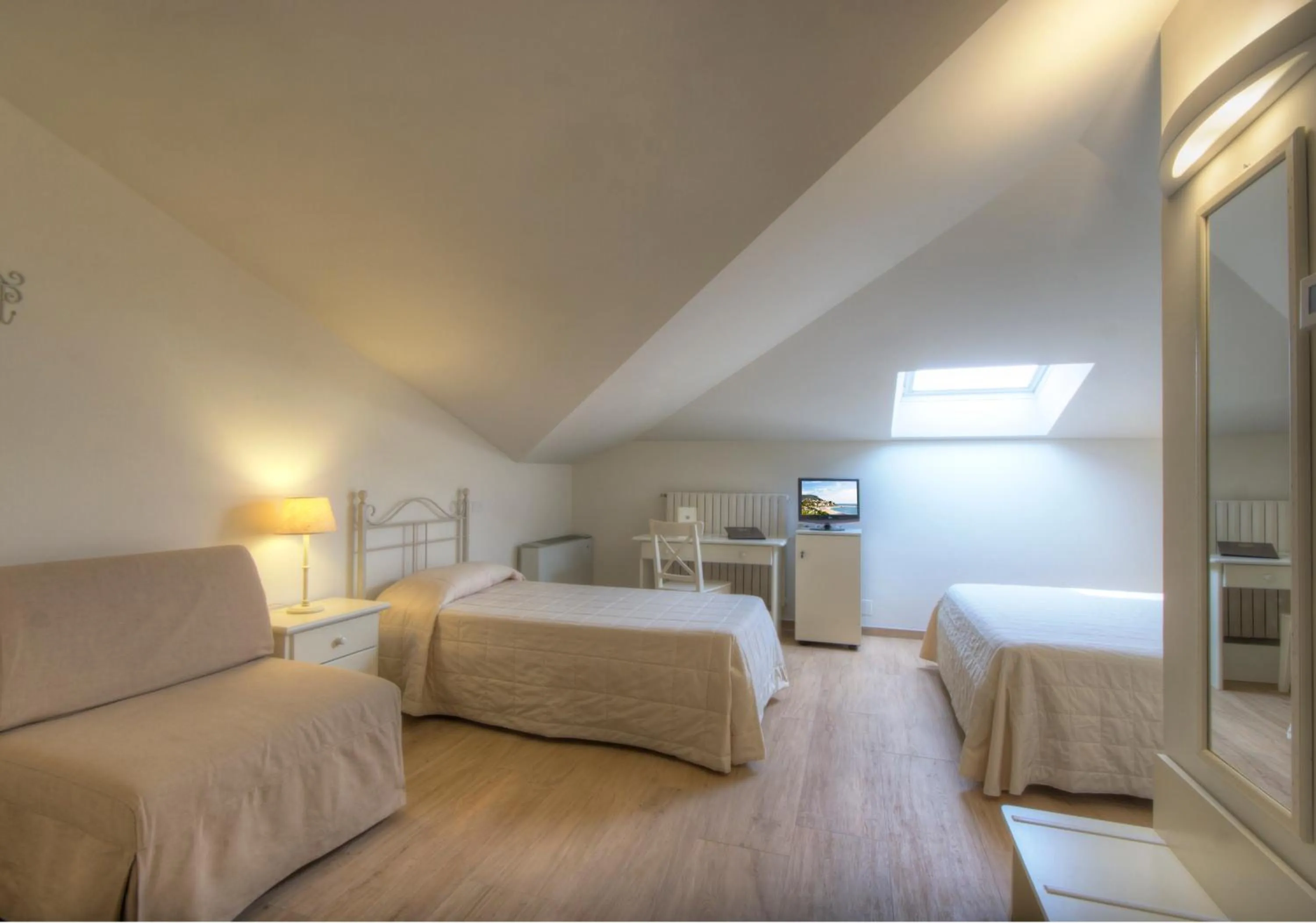 Bed in Hotel Giardino Suites&Spa