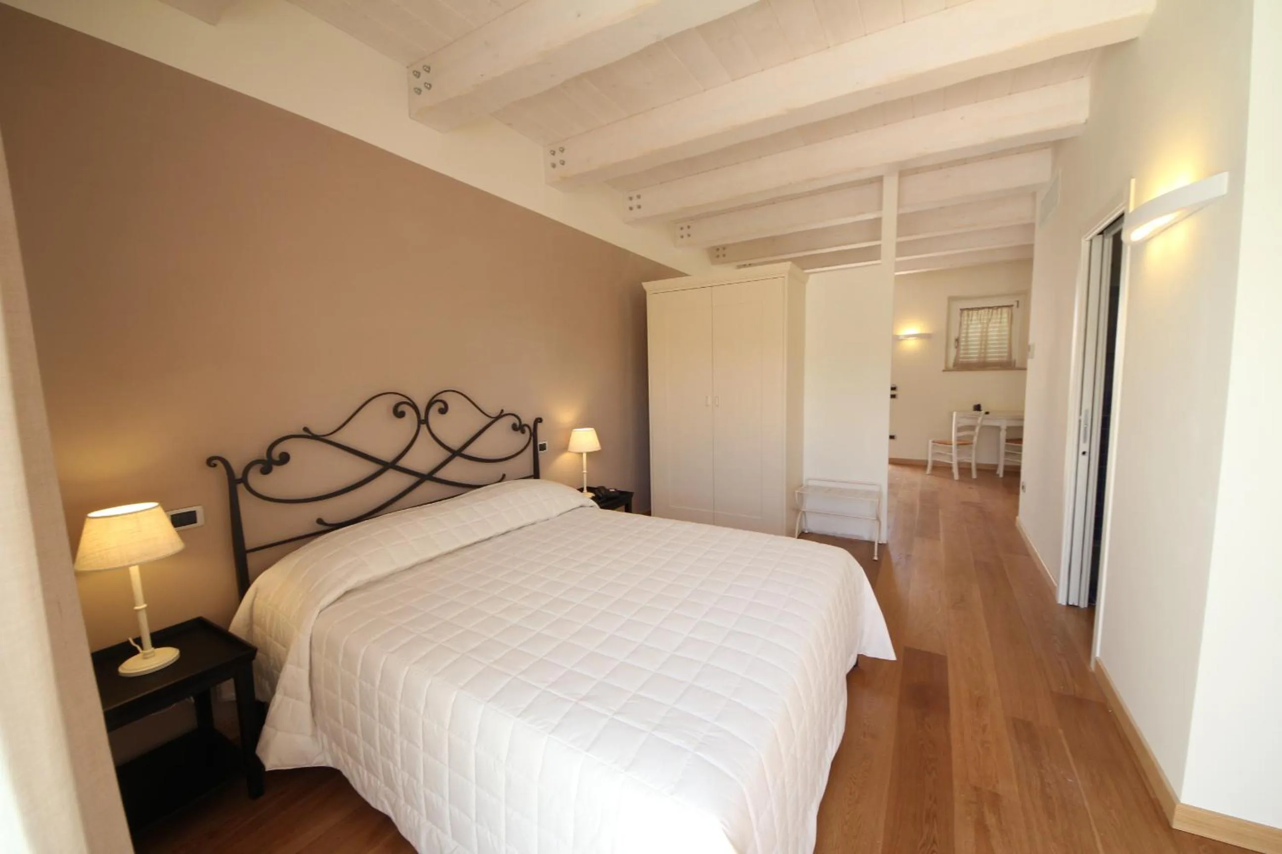 Bed in Hotel Giardino Suites&Spa