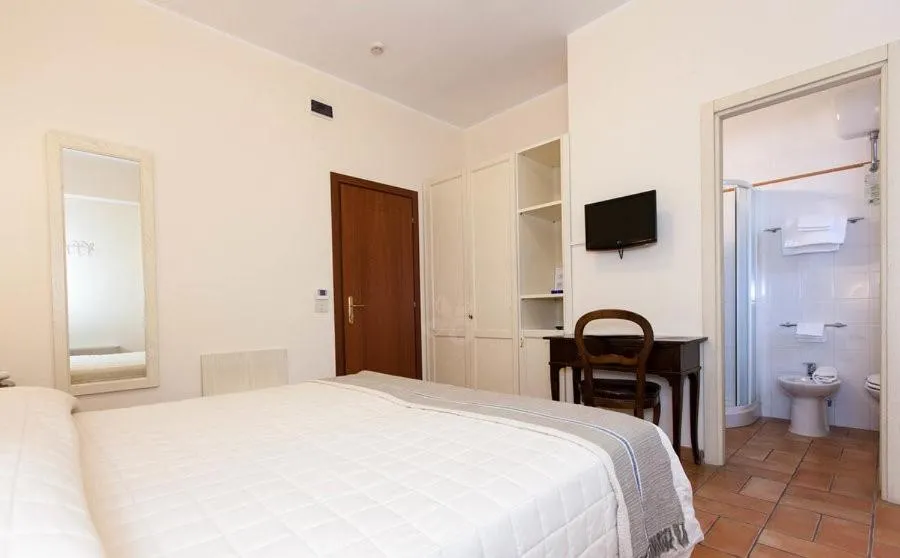 Bed in Hotel Giardino Suites&Spa