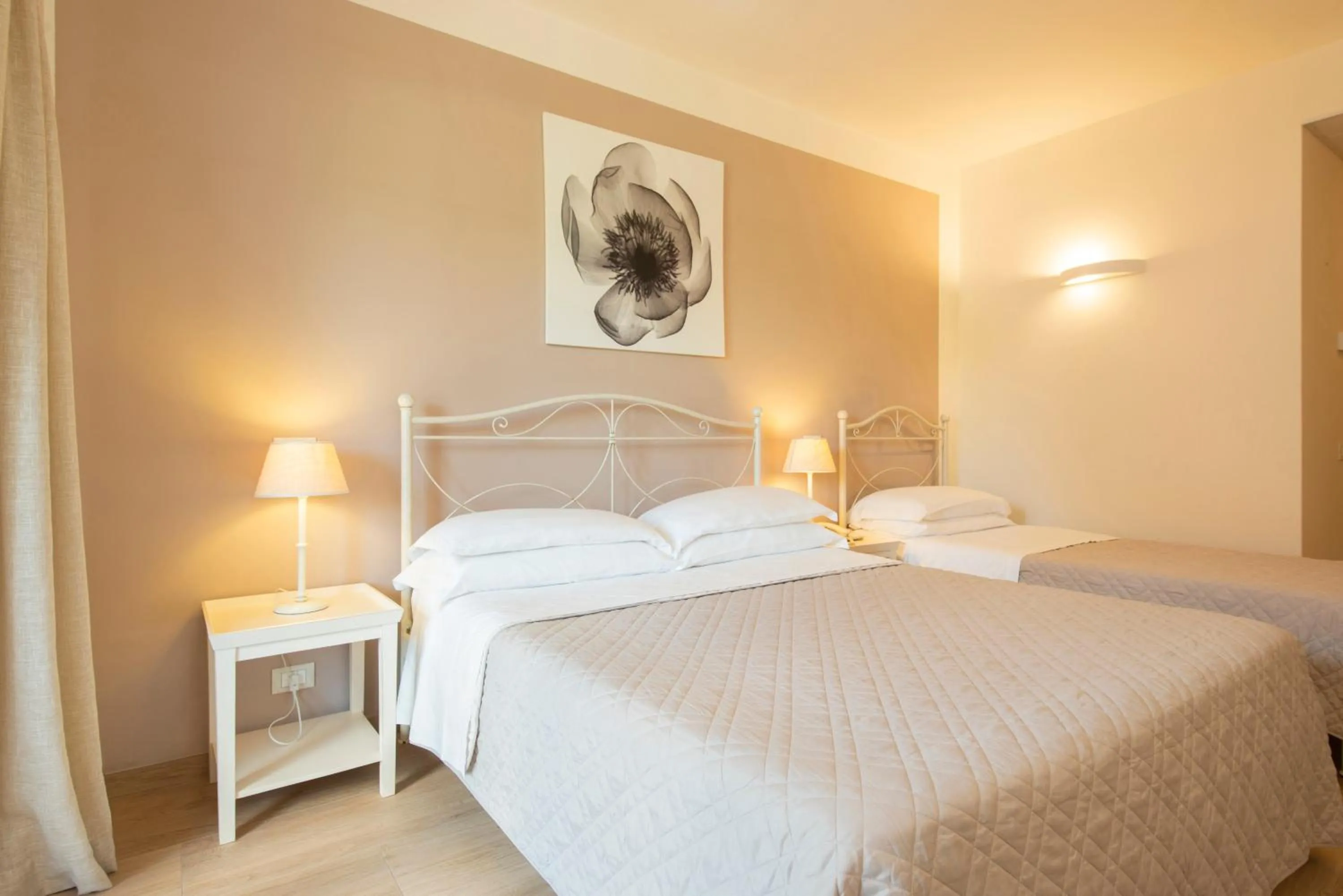Bed in Hotel Giardino Suites&Spa