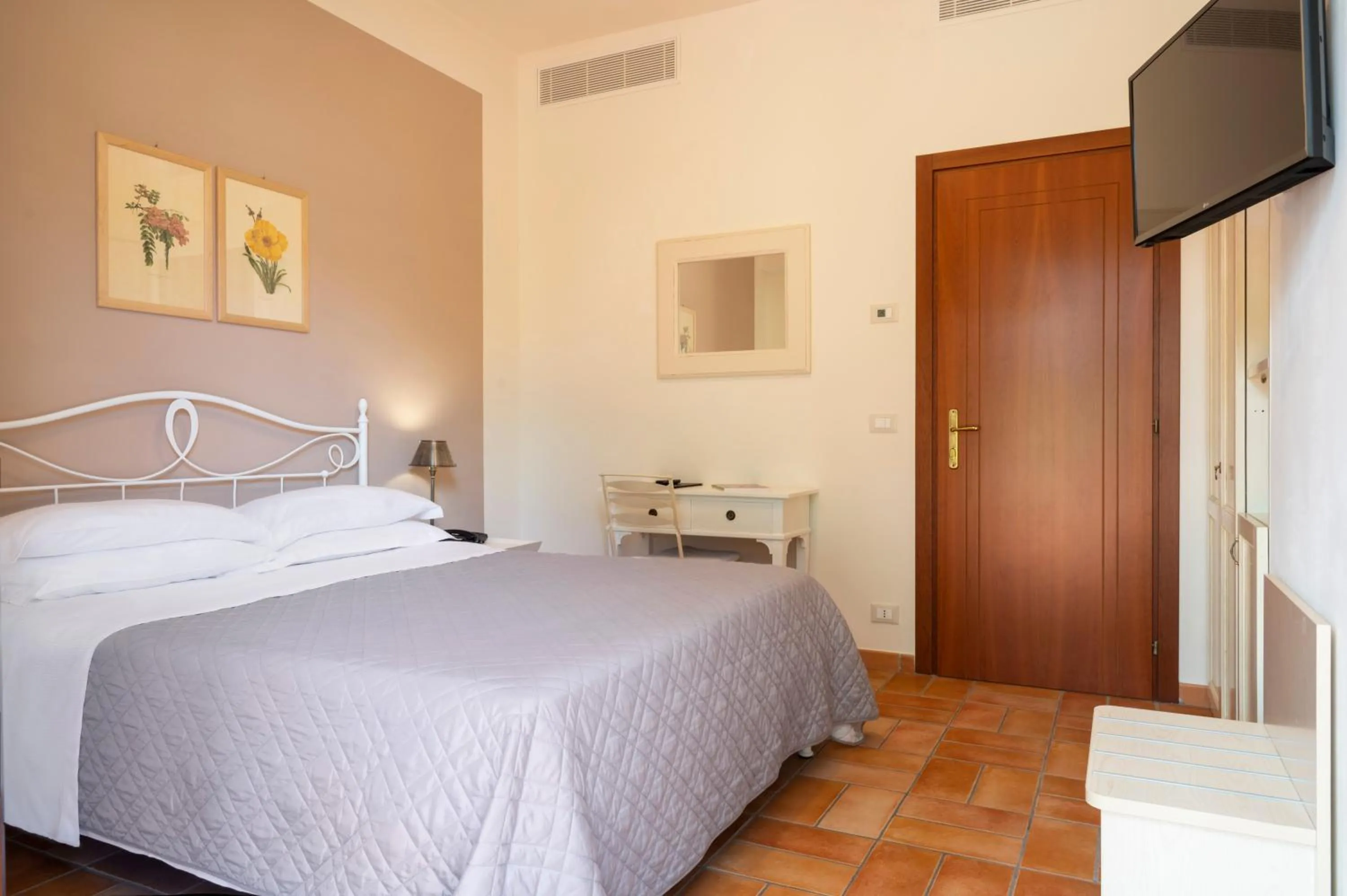 Bed in Hotel Giardino Suites&Spa