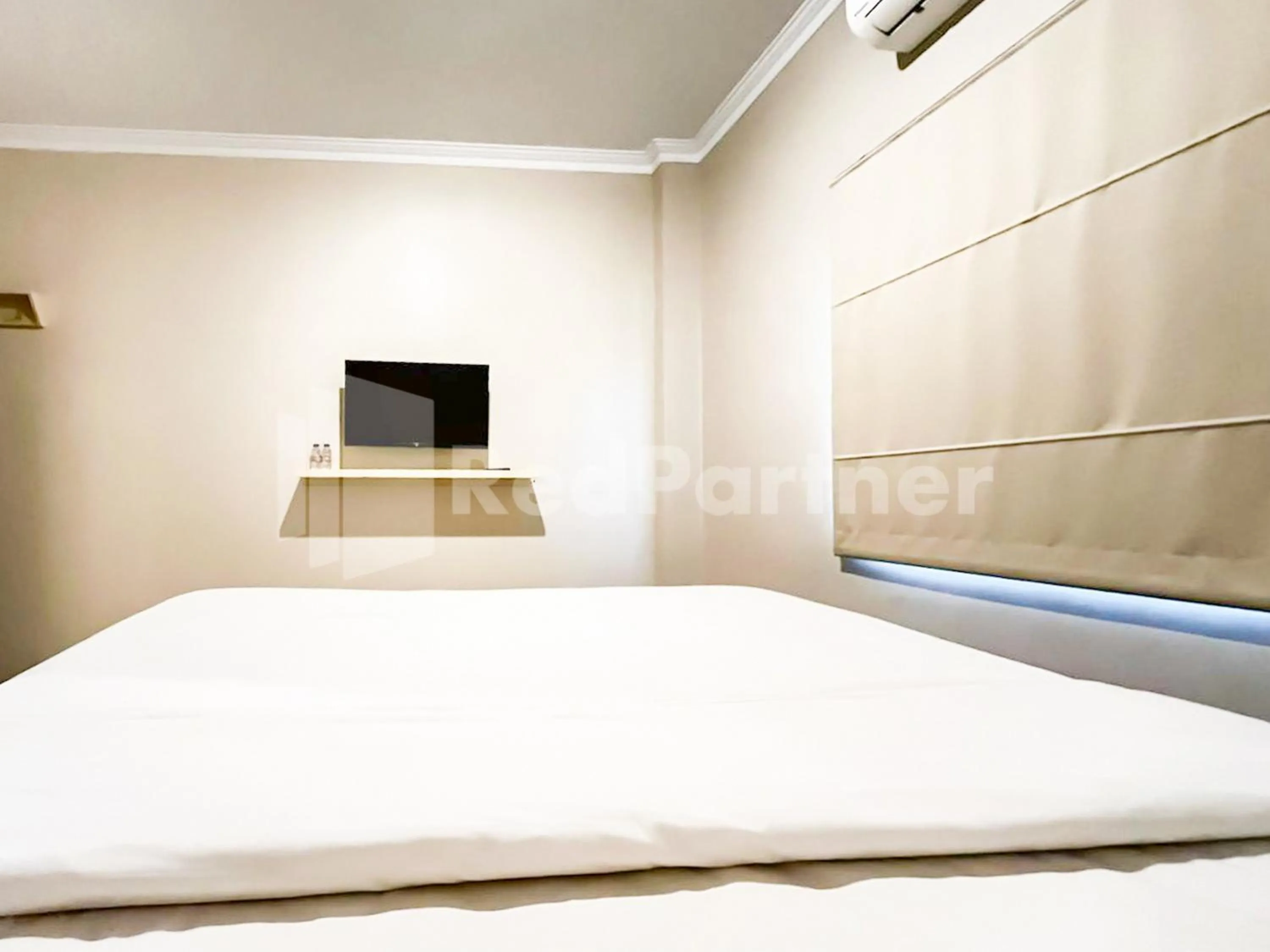 Bed in Hotel Andono near YIA Mitra RedDoorz